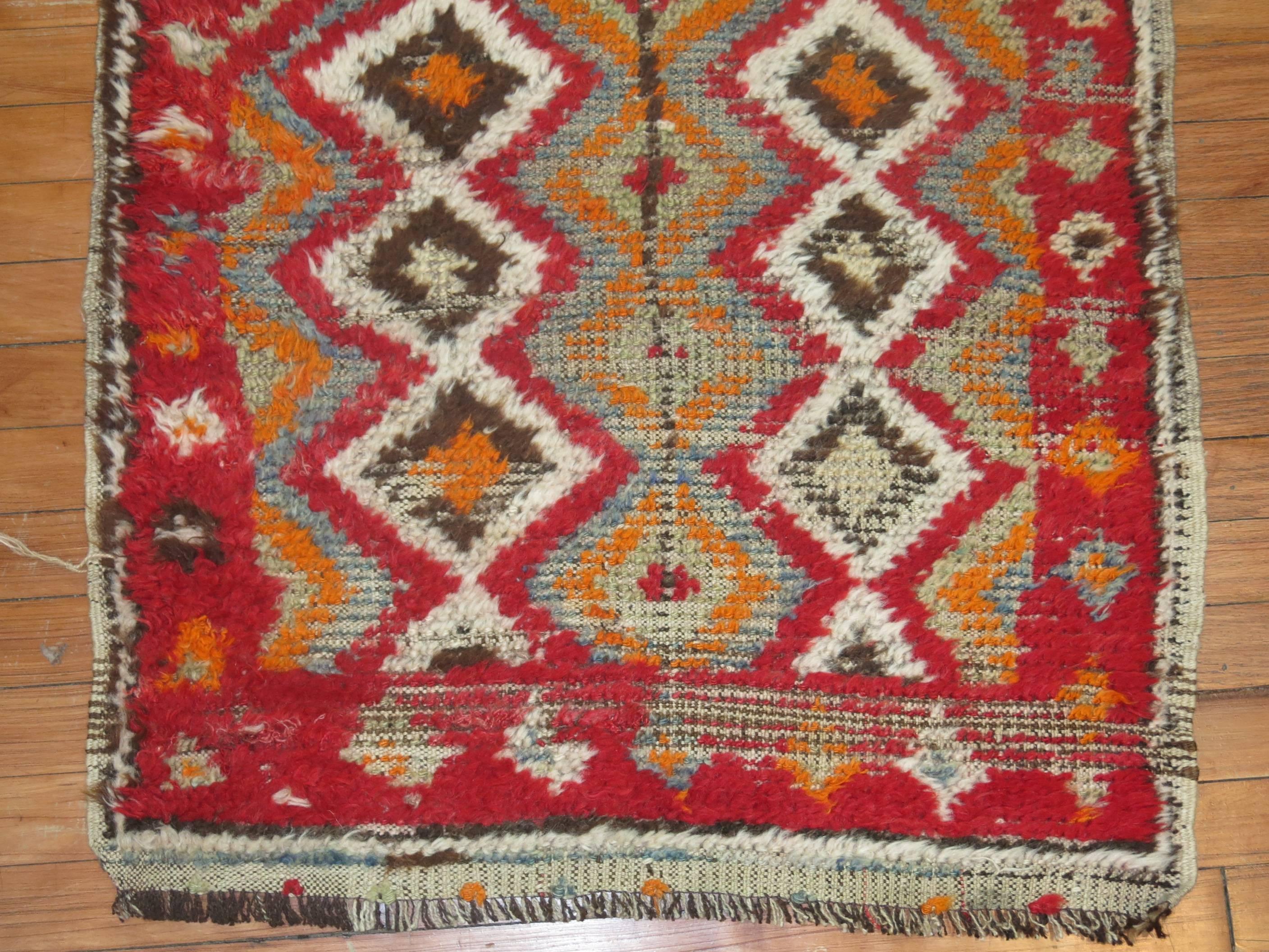 A small square size authentic vintage Moroccan from the early part of the 20th century.