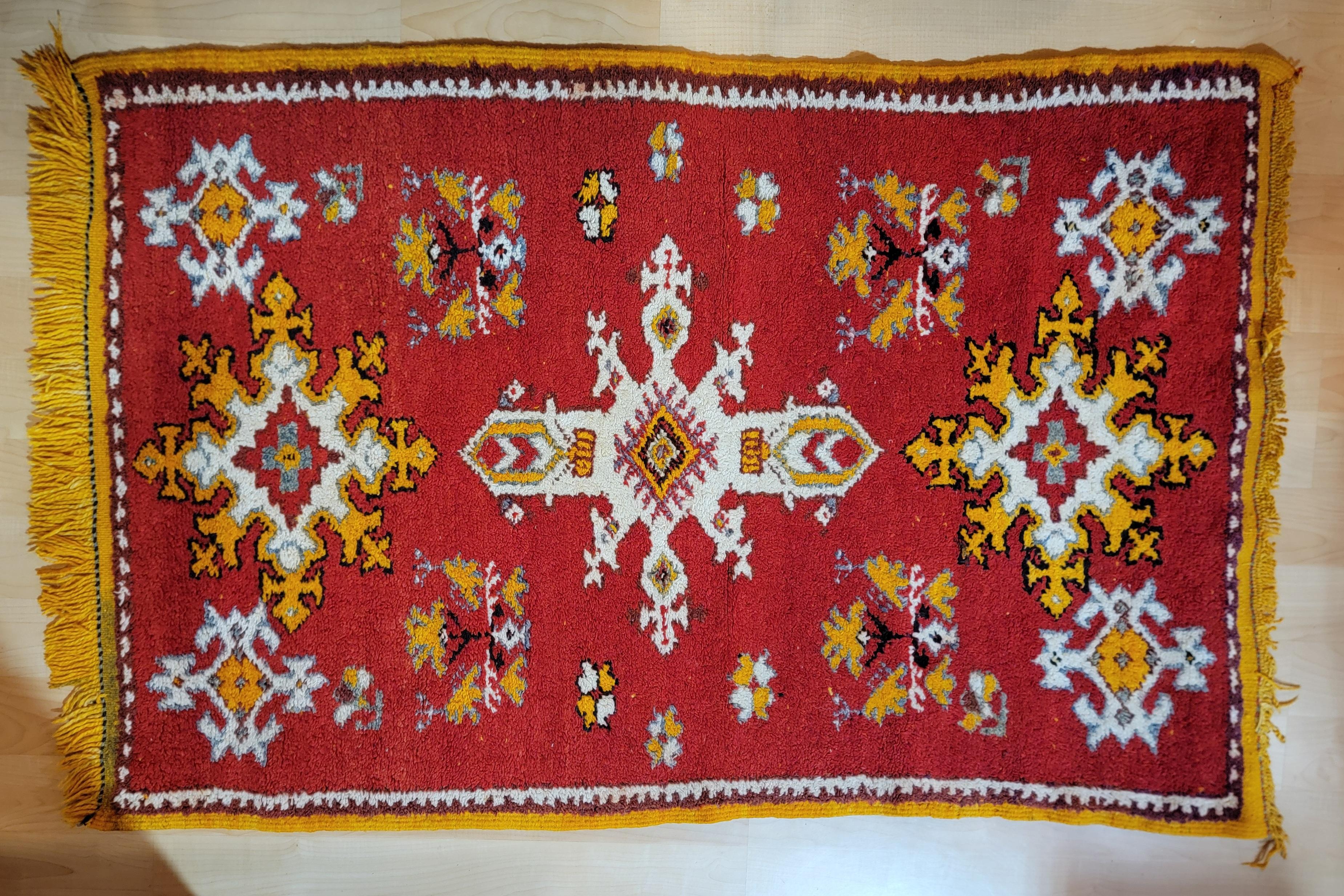 1960's Moroccan rug retaining original label. Measuring 38.5