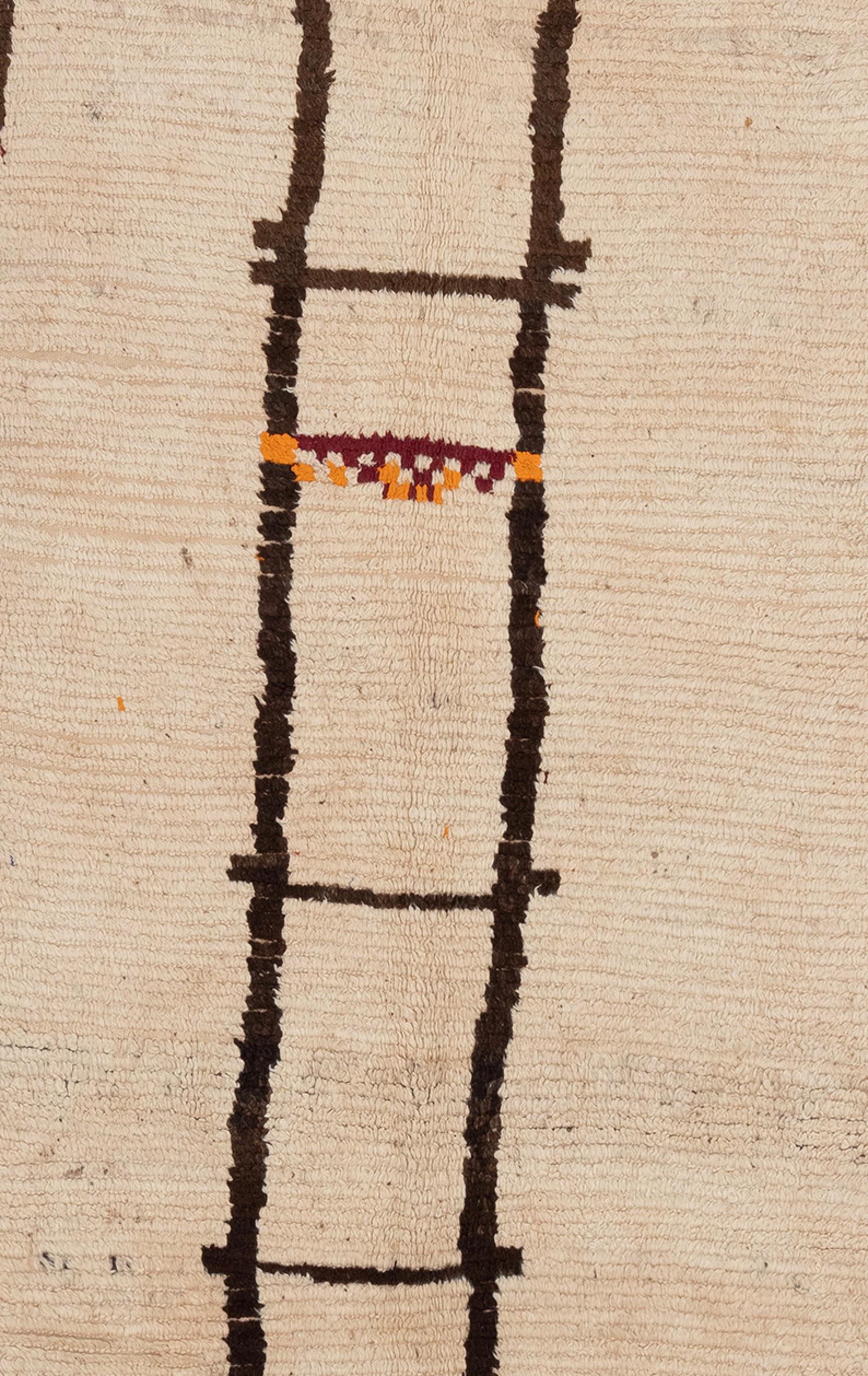Beautiful 1950's Moroccan Rug. Beige background with simple linear lines, with a pop of orange in the center. 100% wool.