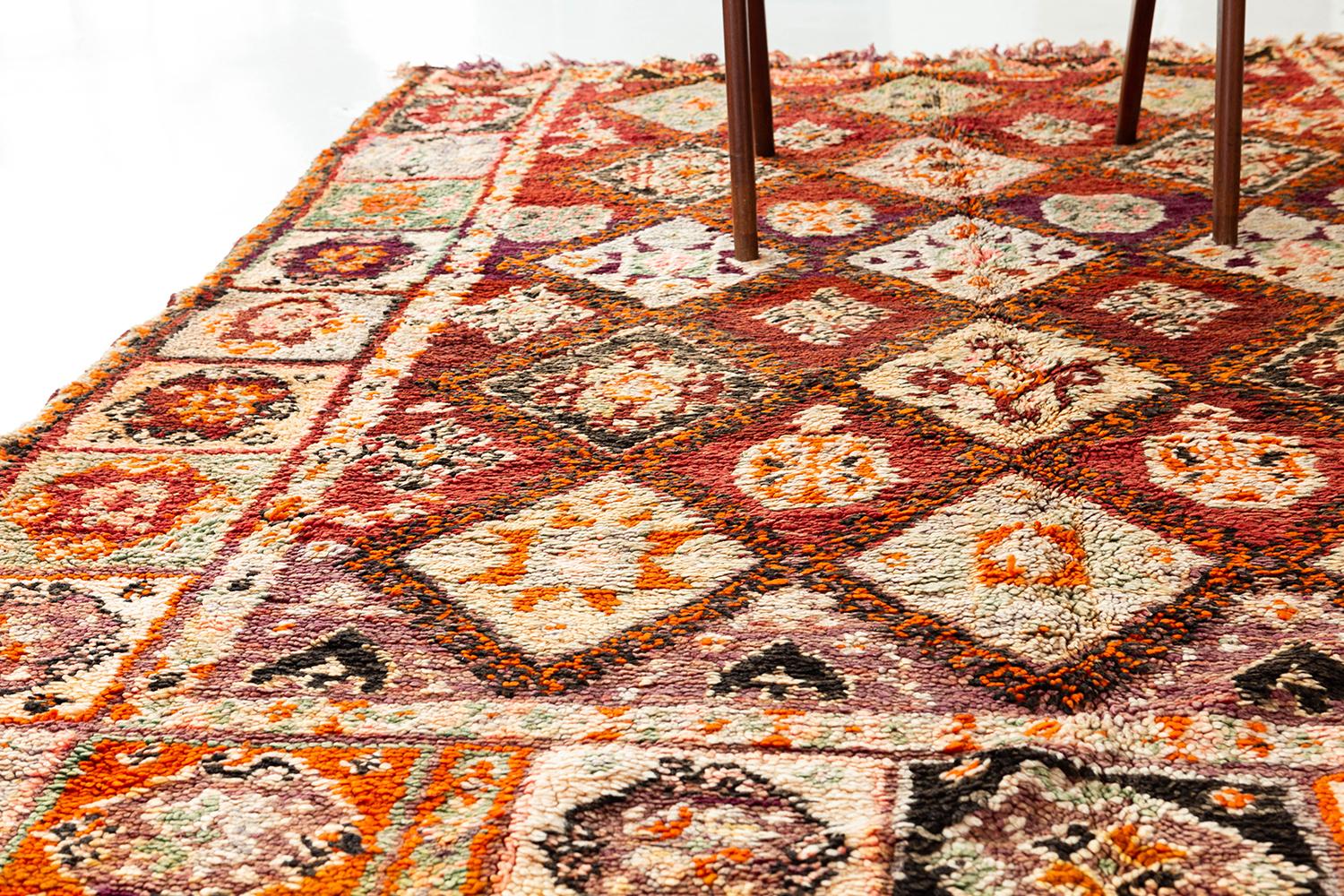 A beautiful vintage Moroccan rug from the High Atlas tribe of Morocco. Intricate patterns and symbolism is handwoven into a one of a kind ethnic art piece. This rug will bring a tasteful essence to any space.
