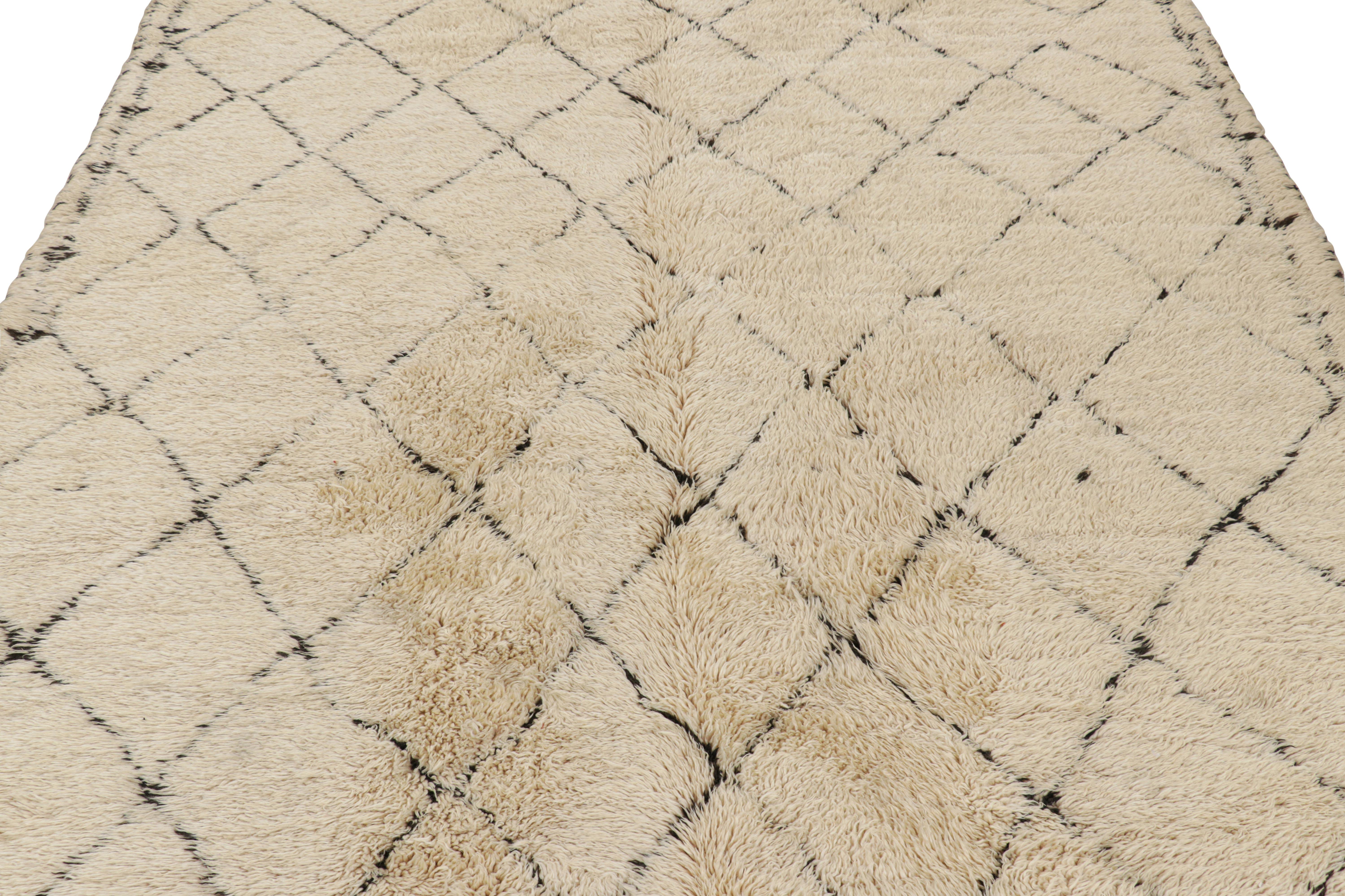 Hand-knotted in wool and originating from Morocco circa 1950-1960, this 6x11 vintage Moroccan rug is an extremely rare piece like so few of its provenance. 

On the Design: 

Admirers of the craft will note what an exceptional find this shabby chic