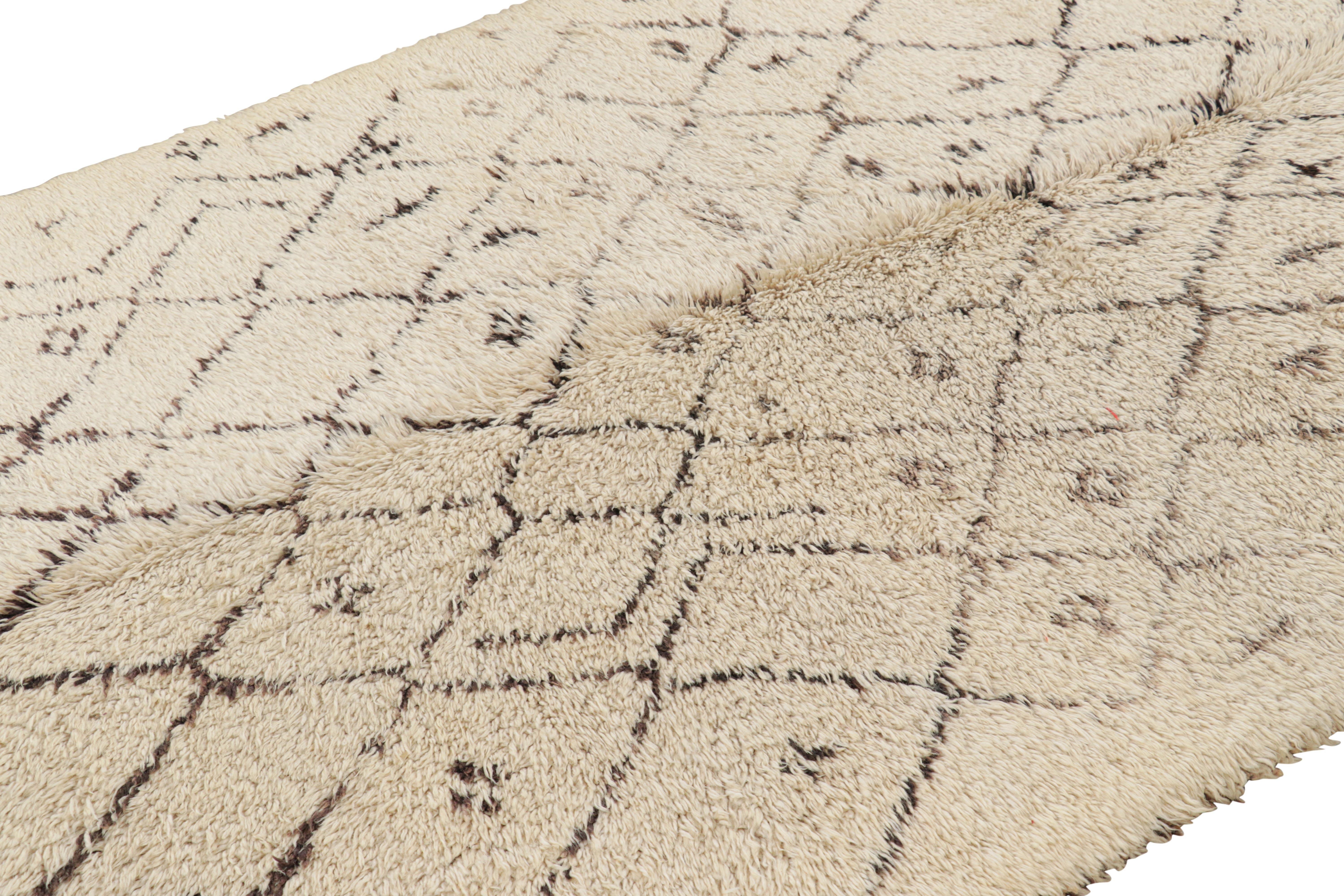 Hand-knotted in wool and originating from Morocco circa 1950-1960, this 6x11 vintage Moroccan rug is an extremely rare piece like so few of its provenance. 

On the Design: 

Admirers of the craft will note what an exceptional find this shabby chic