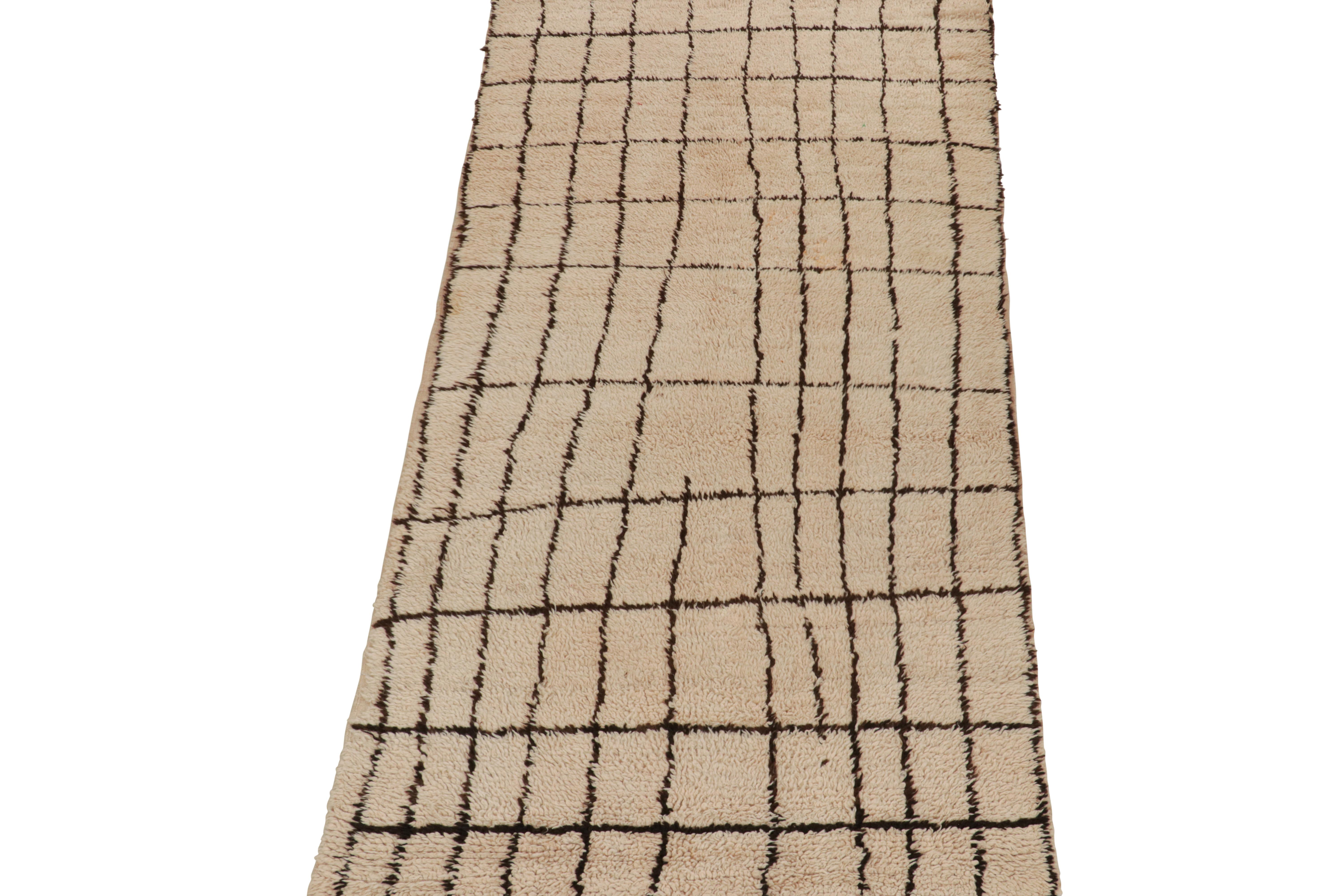 Hand-knotted in wool and hailing from Morocco circa 1950-1960, this 5x10 vintage Moroccan rug is a new curation from Rug & Kilim. 

On the Design: 

Connoisseurs may note that this piece is believed to be an Azilal rug, handmade by nomadic tribal