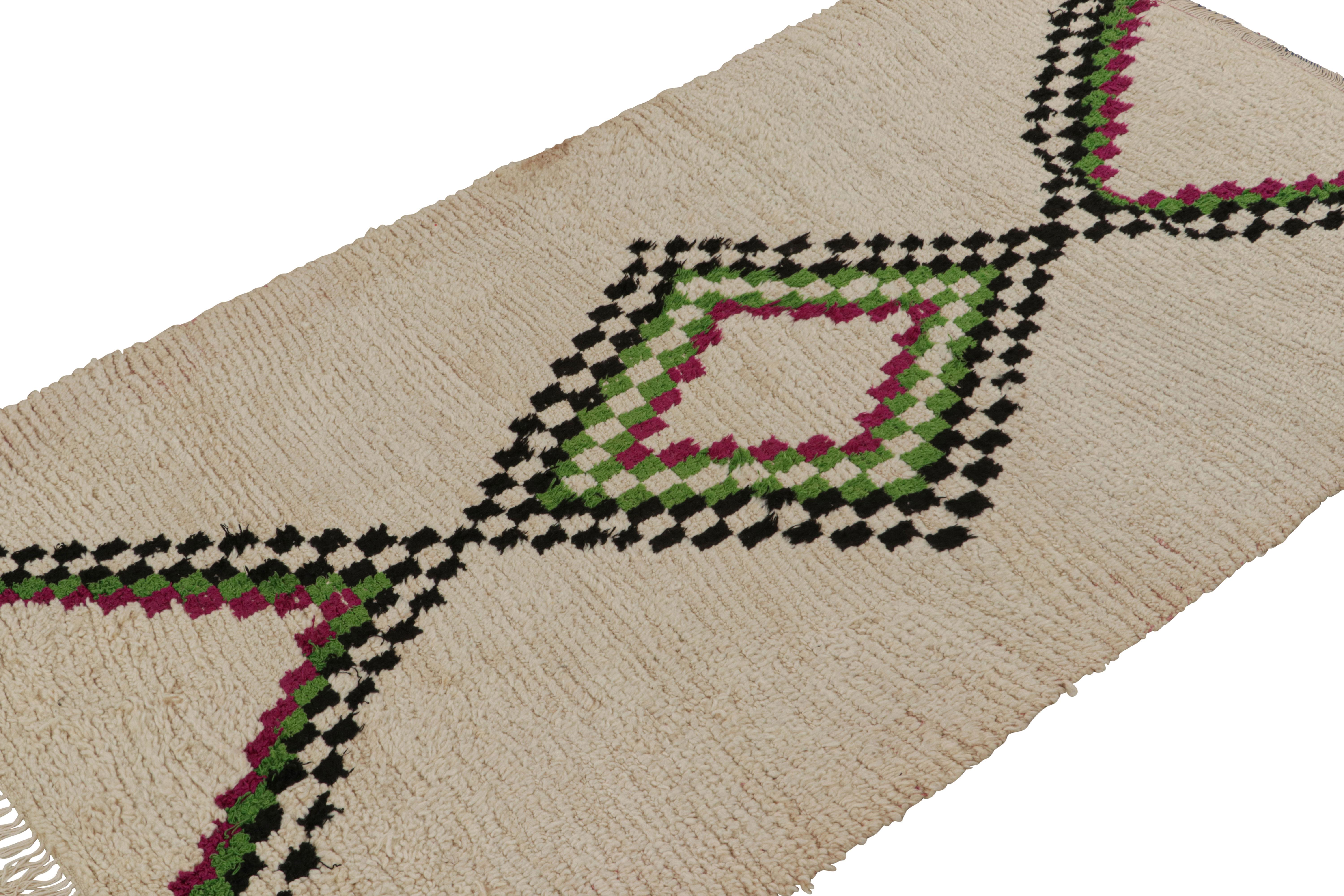 Hand-knotted in wool circa 1950-1960, this 4x6 vintage Moroccan runner rug in beige with colorful medallion, hails from the Azilal tribe.  

On the Design: 

This piece enjoys a lush high pile with primitivist Berber geometric diamond medallion or