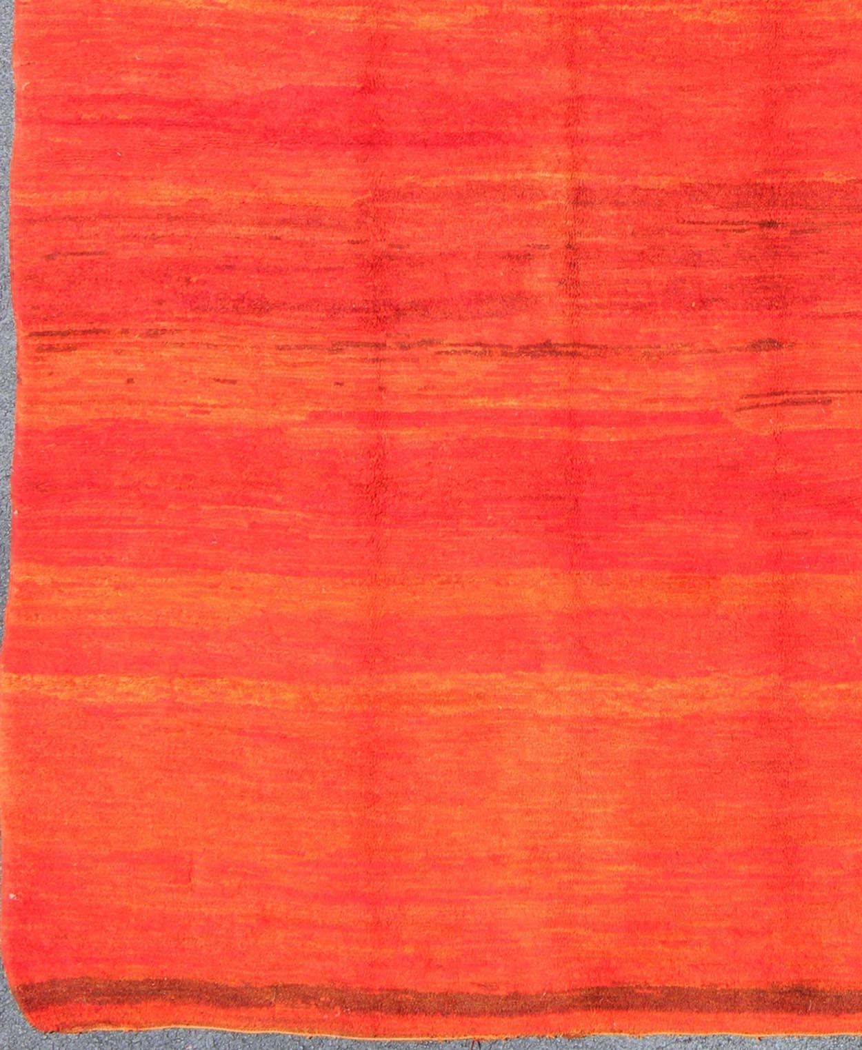 Vintage Moroccan Rug in Desert Red and Orange Colors.
This lovely vintage Moroccan rug displays a multitude of desert red and orange tones that vary throughout the solid field. 
Measures: 7'1 x 10'2.
List price $7,500.
Reduced price $6,000.