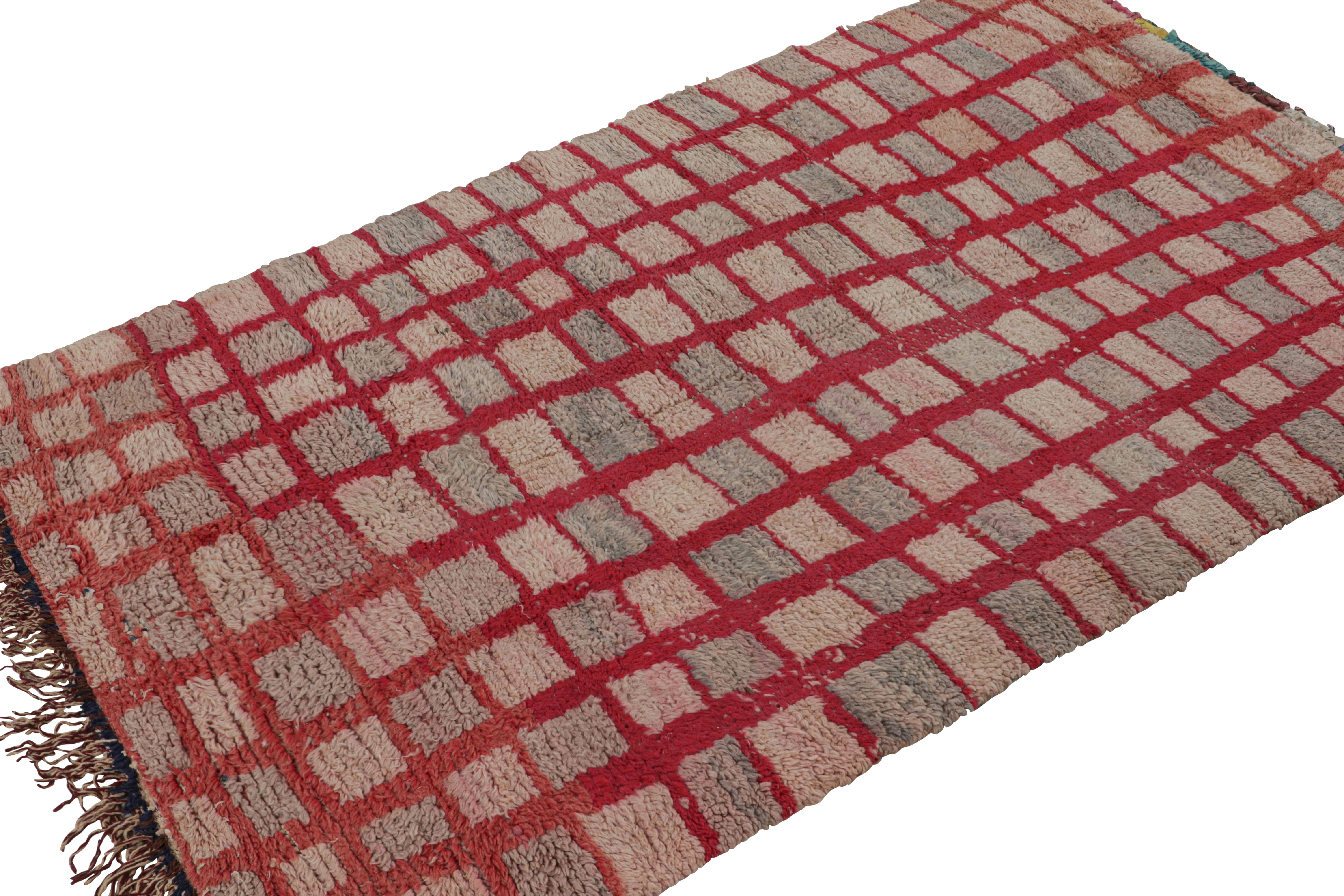 Hand-knotted in wool circa 1950-1960, this 4x7 vintage Moroccan rug with grid geometric patterns, hails from the Azilal tribe.  

On the Design: 

Connoisseurs may admire this rug as a bold, graphic piece with drama and gravity—a work of presence