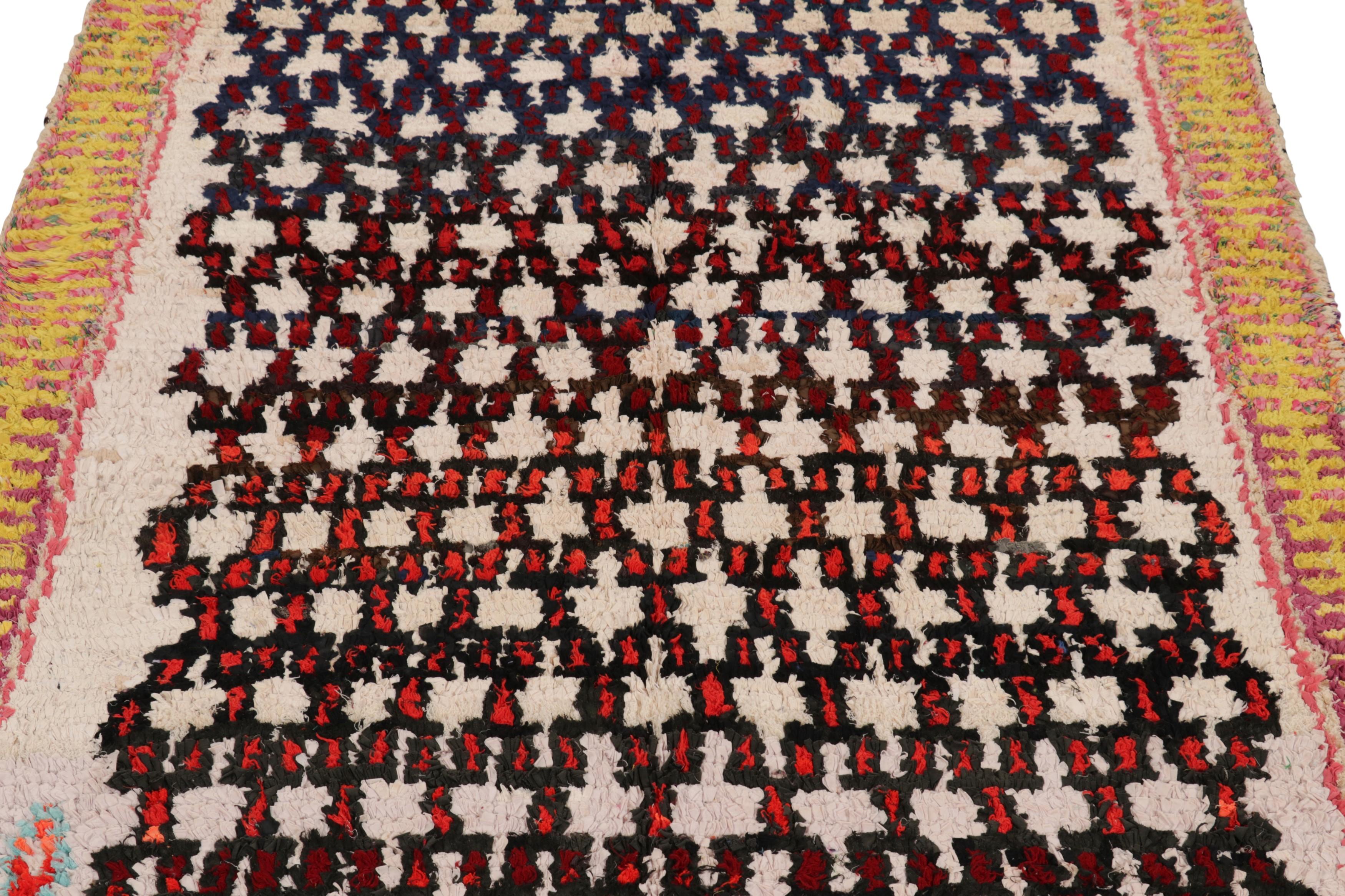 Hand-knotted in wool and originating from Morocco circa 1950-1960, this 4x6 vintage rug is a rare and among the most exciting new additions to Rug & Kilim’s mid-century curations from the region.

On the Design:

The mesmerizing all-over pattern