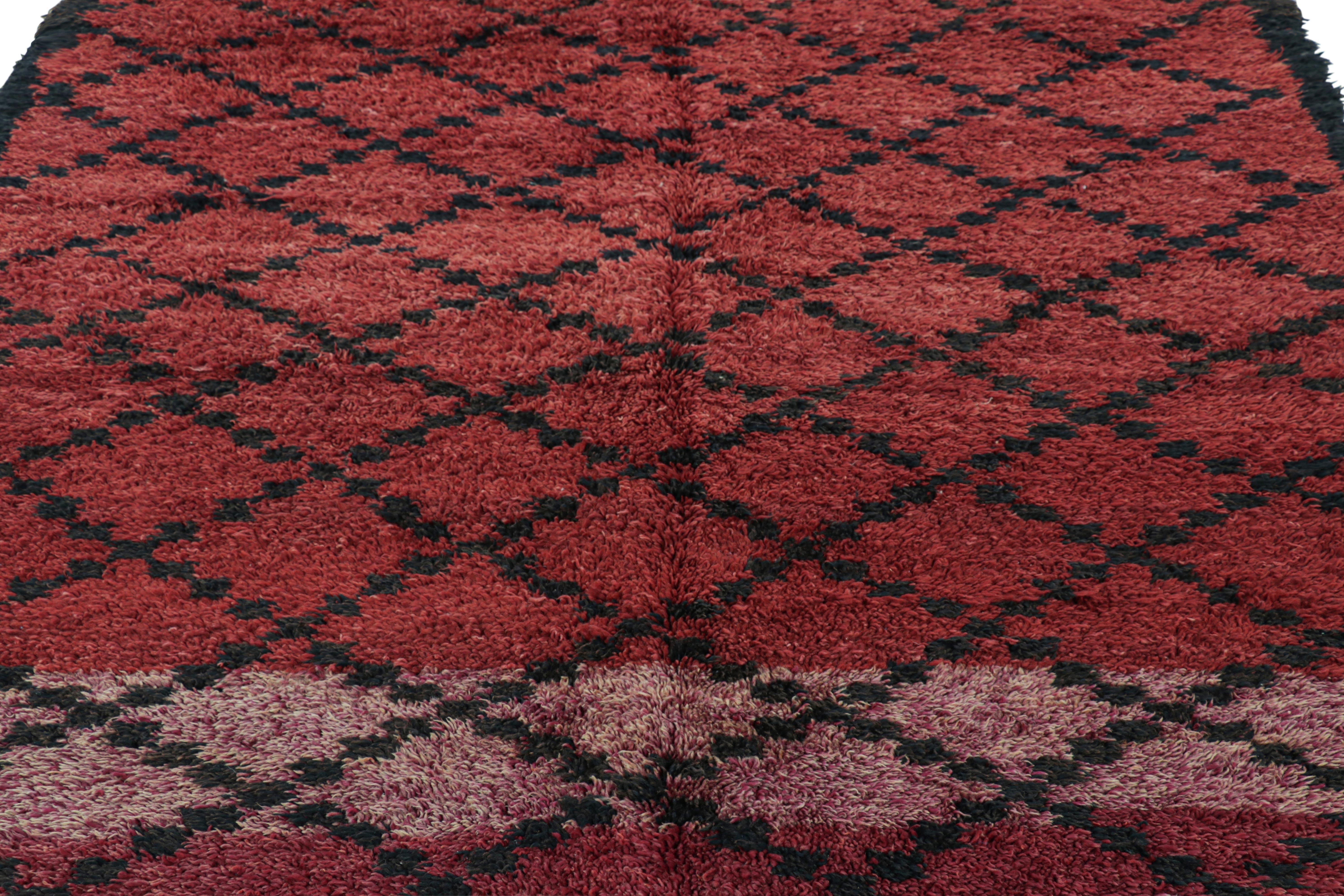 Hand-knotted in wool and originating from Morocco circa 1950-1960, this 7x10 vintage Moroccan rug is an extremely rare piece like so few of its provenance. 

On the Design: 

Admirers of the craft will note what an exceptional find this shabby chic