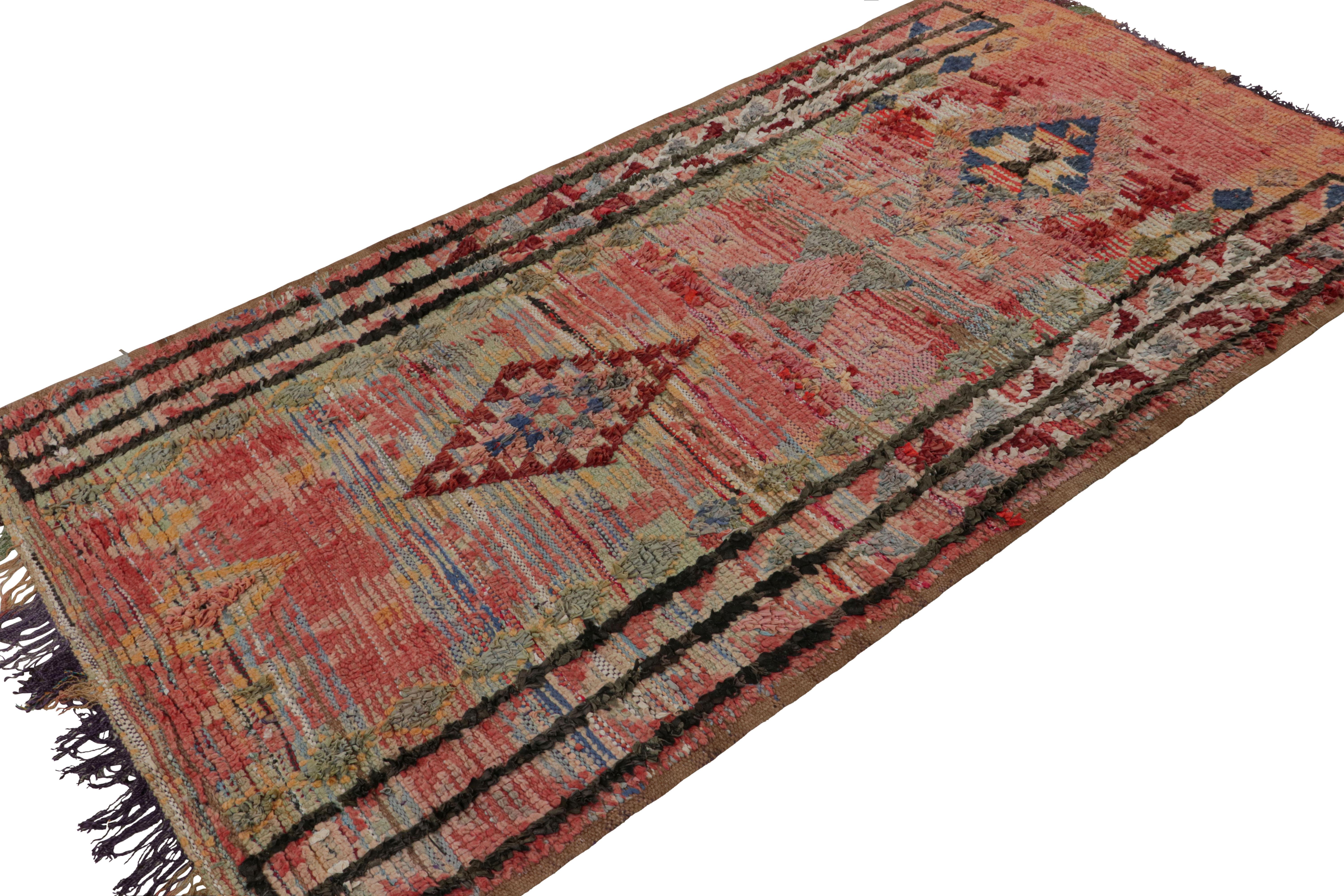 Hand-knotted in wool circa 1950-1960, this 4x8 vintage Moroccan rug with polychromatic geometric patterns and medallions, hails from the Azilal tribe.  

On the Design: 

Connoisseurs may admire this runner as a bold, graphic piece with drama and