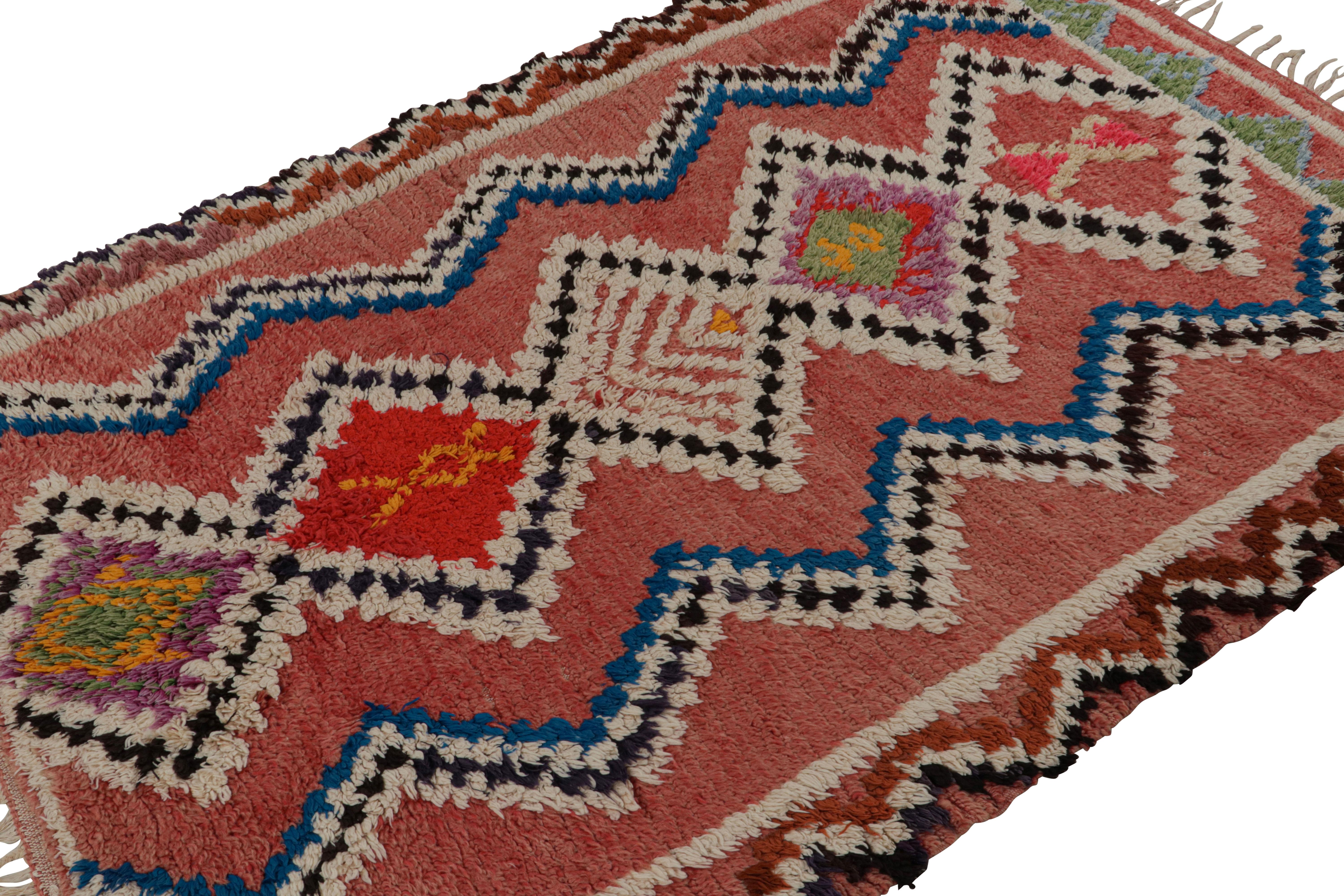 Hand-knotted in wool circa 1950-1960, this 5x7 vintage Moroccan rug with polychromatic geometric patterns and medallions hails from the Azilal tribe.  

On the Design: 

Connoisseurs may admire this runner as a bold, graphic piece with drama and