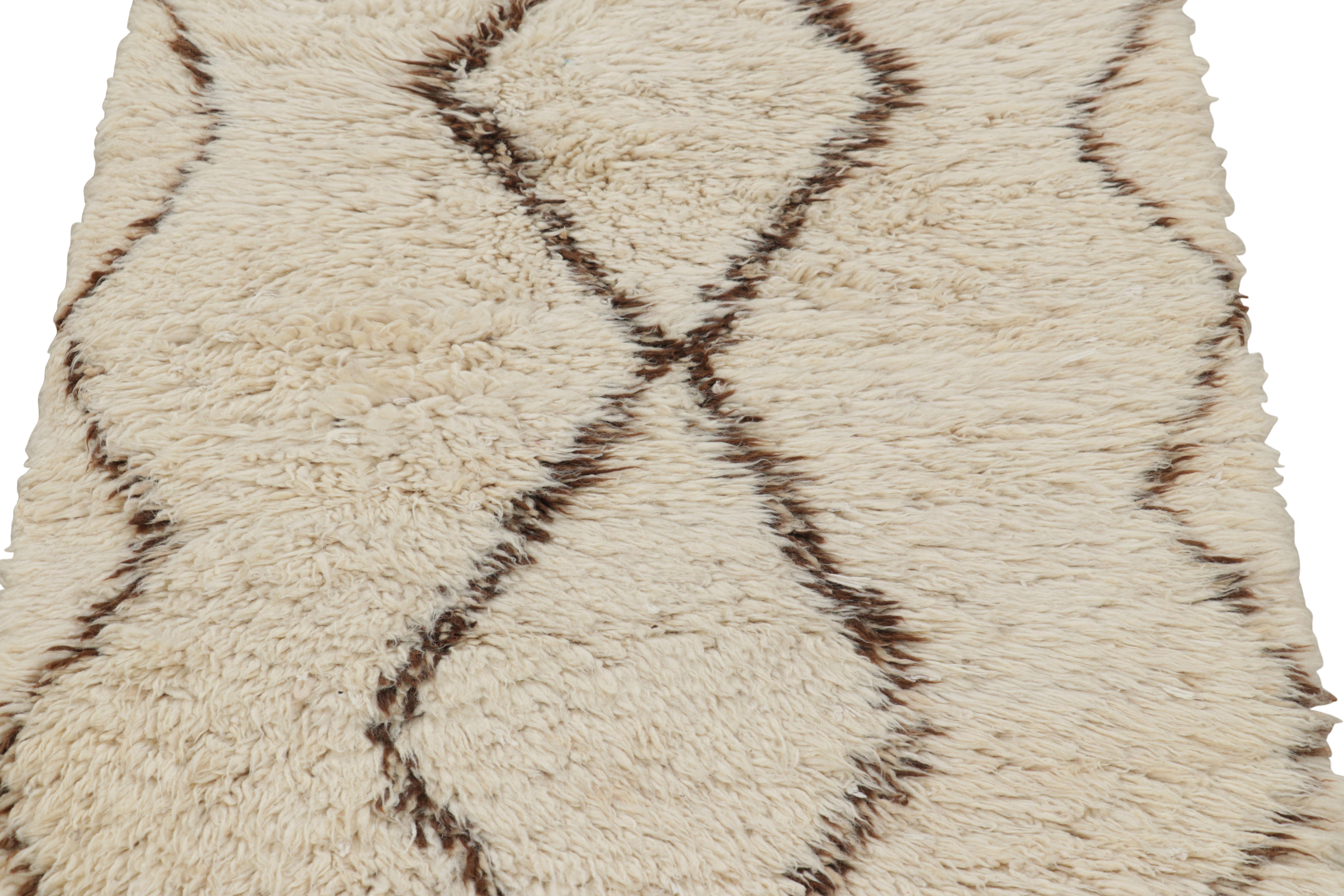 Hand-knotted in wool and originating from Morocco circa 1950-1960, this 3x5 vintage Moroccan rug is an extremely rare piece like so few of its provenance. 

On the Design: 

Admirers of the craft will note what an exceptional find this shabby chic