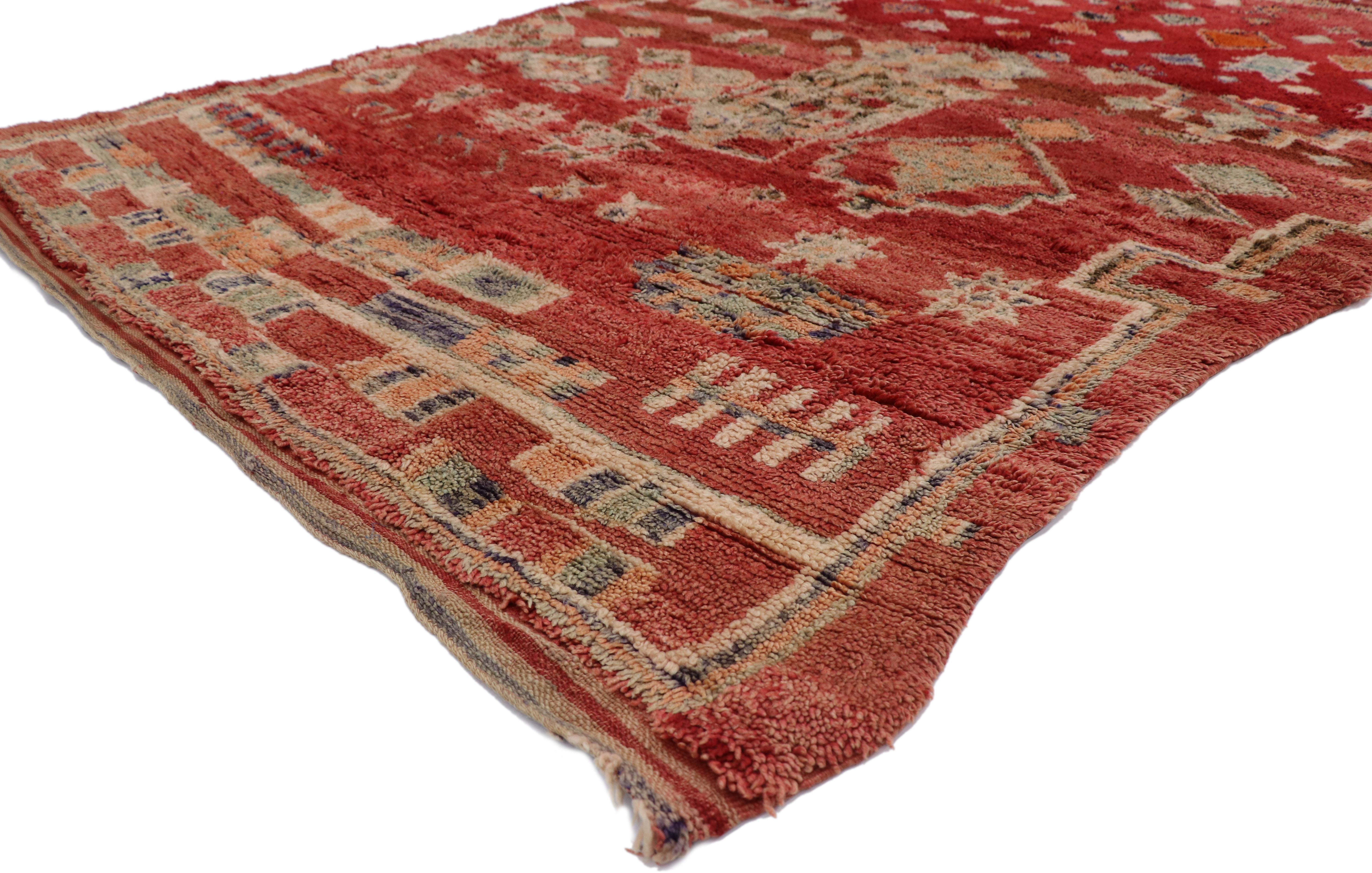 21323 Vintage Red Moroccan Rug, 05'09 x 08'05.
Reflecting elements of Wabi-Sabi and nomadic charm, this hand knotted wool vintage Moroccan rug is a captivating vision of woven beauty. The perfectly imperfect tribal design and vibrant colors woven