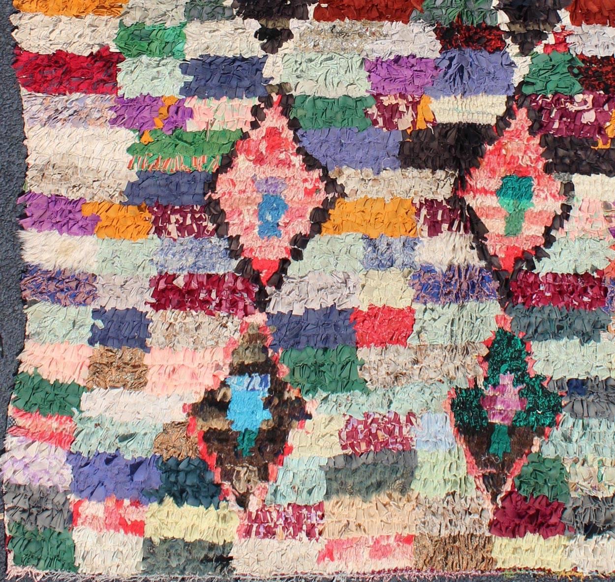 Measures: 5'2 x 6'7.
Vintage Boucharouette Moroccan rug with diamond and Checkered Design multi colors.
Rendered in diamond shapes with a spotted and speckled assortment of rich colors, this very unique Moroccan rug has an abstract design with