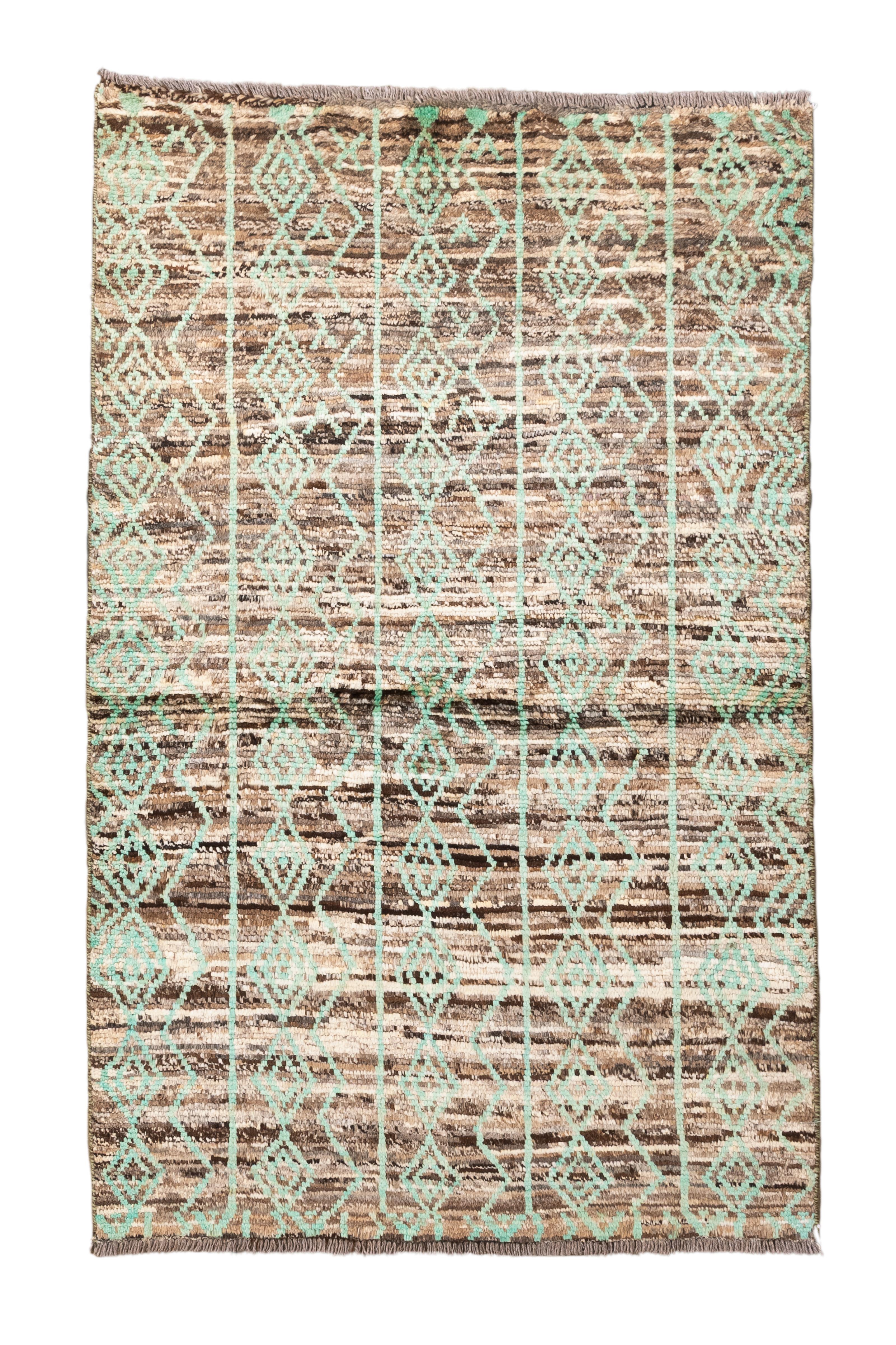 A modern take on tribal tradition, this vintage Moroccan rug showcases a series of pale aqua diamond motifs arranged in vertical columns against a richly variegated brown and beige ground. The contrast between the geometric clarity of the aqua