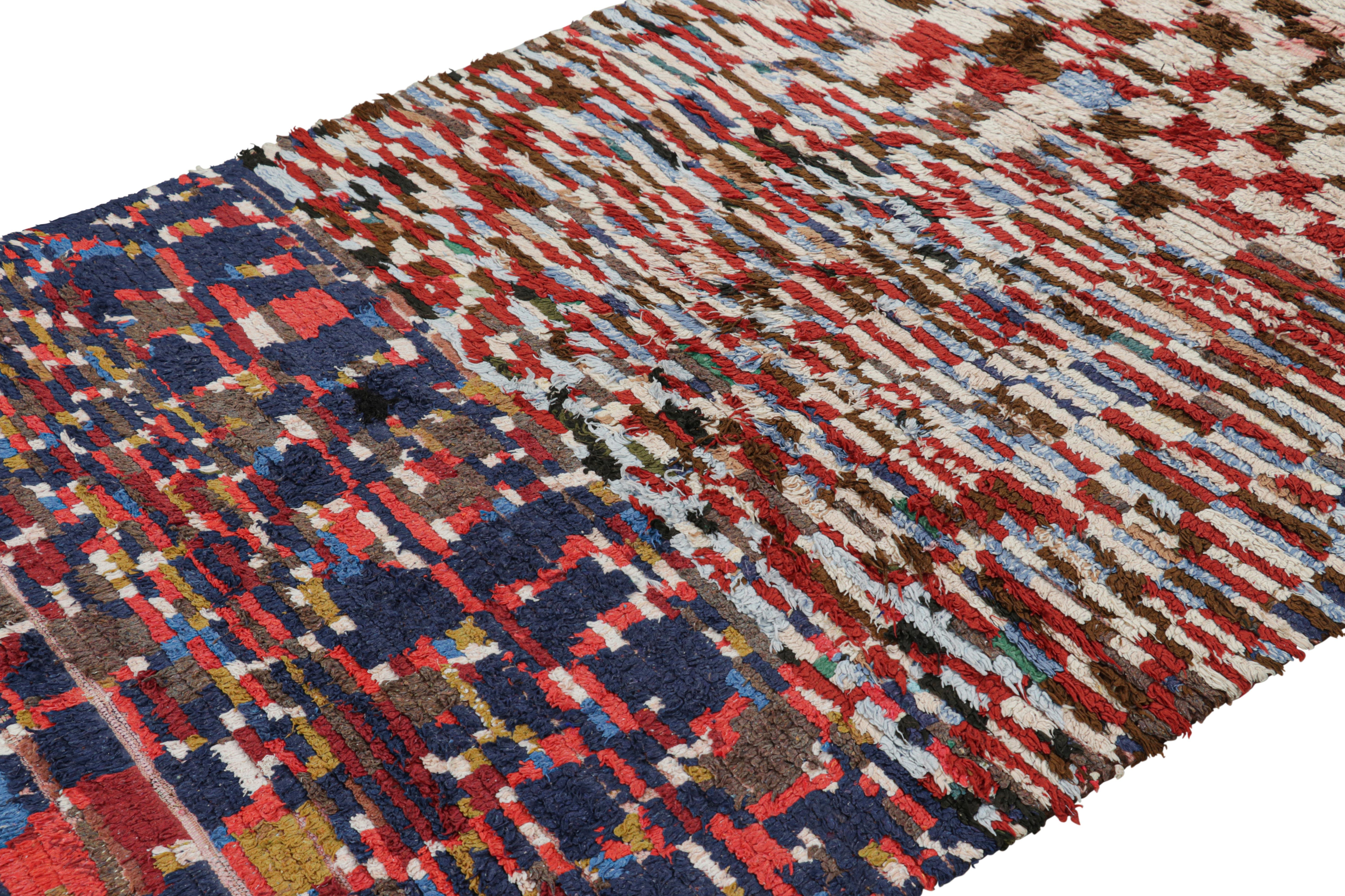 Hand-knotted in wool and originating from Morocco circa 1950-1960, this 5x8 vintage Moroccan rug is an extremely rare piece like so few of its provenance. 

On the Design: 

Admirers of the craft will note what an exceptional find this shabby chic