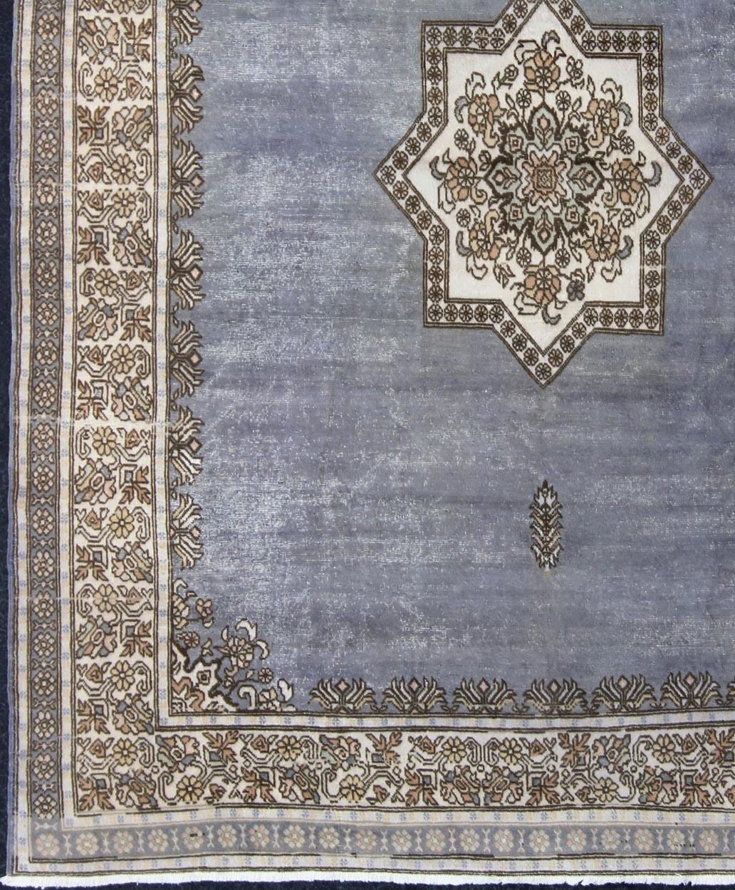 Grayish-blue traditional Medallion design Moroccan rug. Keivan Woven Arts /  rug 13-0607, country of origin / type: Morocco / Tribal, circa 1960
This Moroccan rug features a traditional medallion design consisting of a star motif in the central