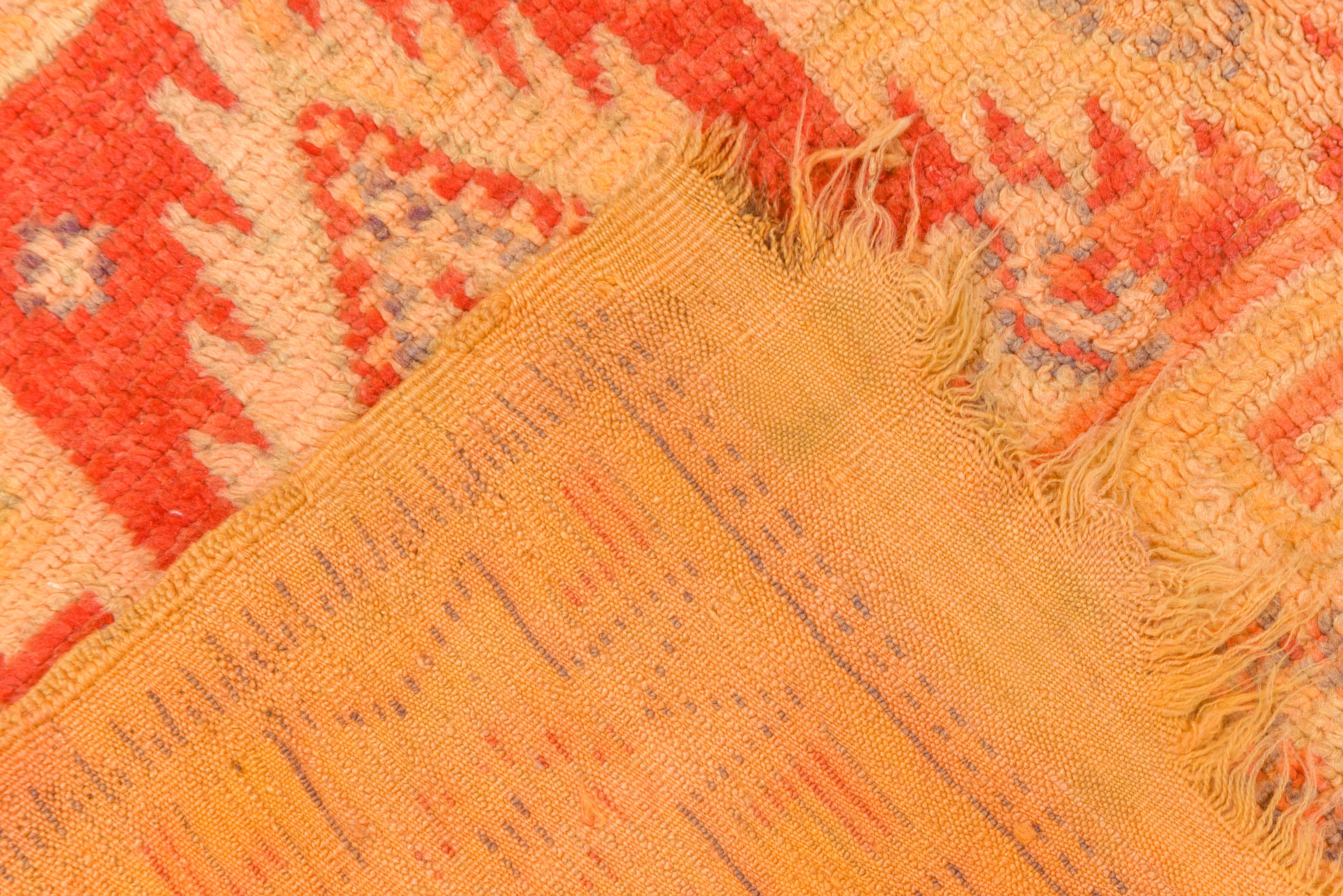 This vintage rustic long scatter shows Caucasian influences with red panels each of three ashiks above and below a red central section with a large straw stepped lozenge. The light yellow border shows 