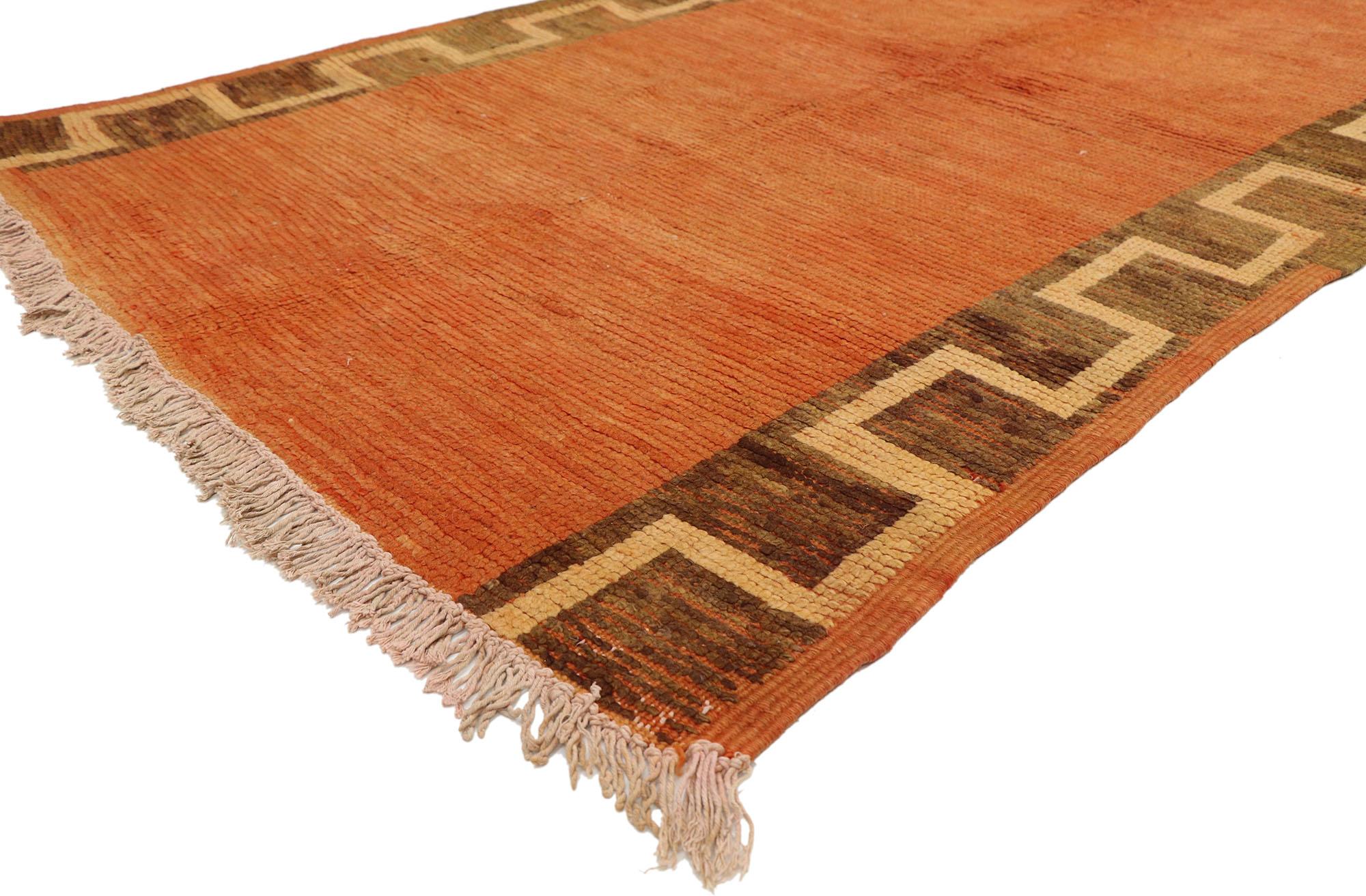 20241 vintage Moroccan runner, extra-long Moroccan Hallway runner. This hand knotted wool vintage Moroccan runner features a lovely abrashed solid field framed by two columns of crenelated borders. Though deceptively simple, this classic design is