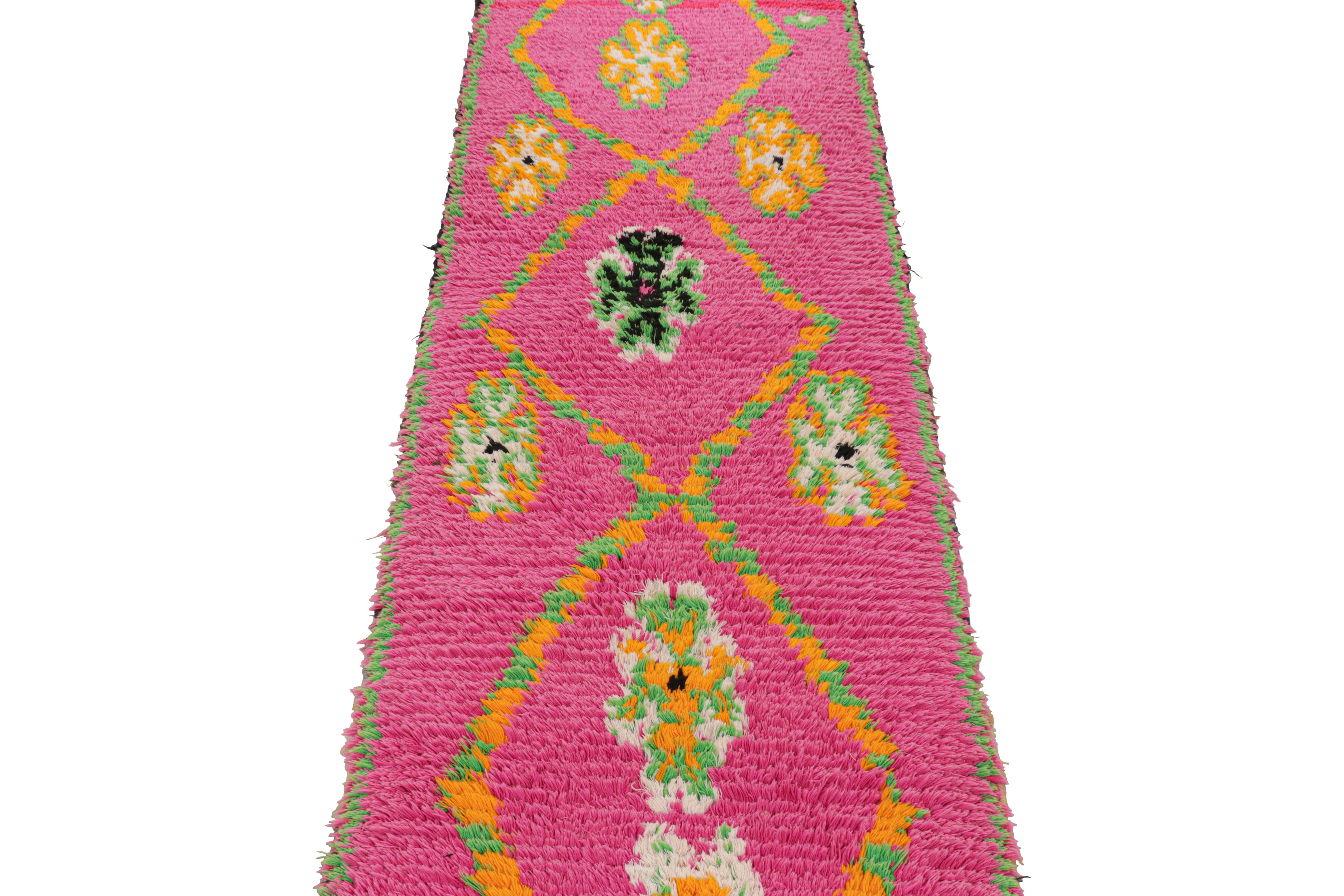 Hand-knotted in wool and originating from Morocco circa 1950-1960, this 2x10 vintage Moroccan rug is an extremely rare piece like so few of its provenance. 

On the Design: 

Admirers of the craft will note what an exceptional find this shabby chic