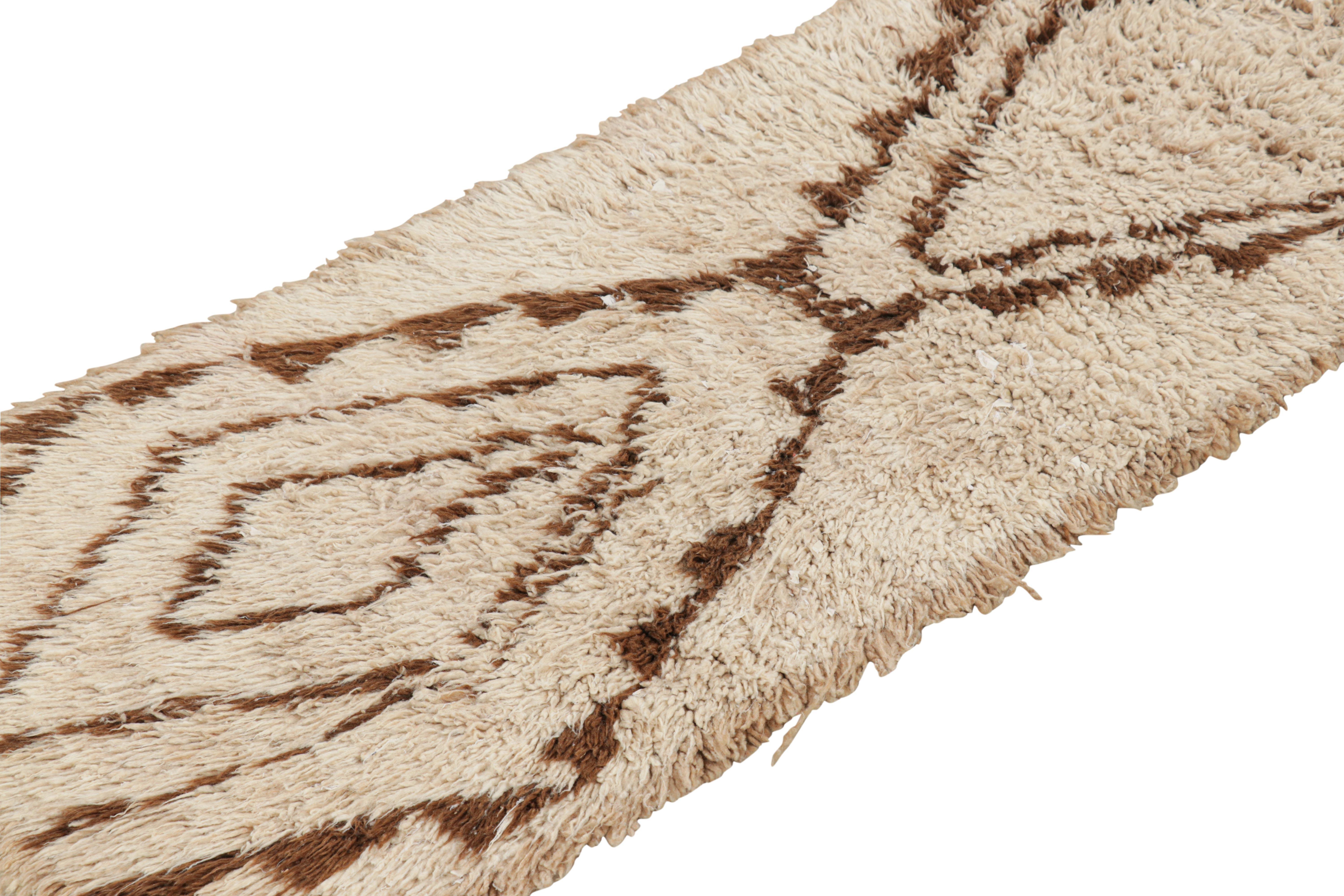 Hand-knotted in wool and originating from Morocco circa 1950-1960, this 2x6 vintage Moroccan rug is an extremely rare piece like so few of its provenance. 

On the Design: 

Admirers of the craft will note what an exceptional find this shabby chic