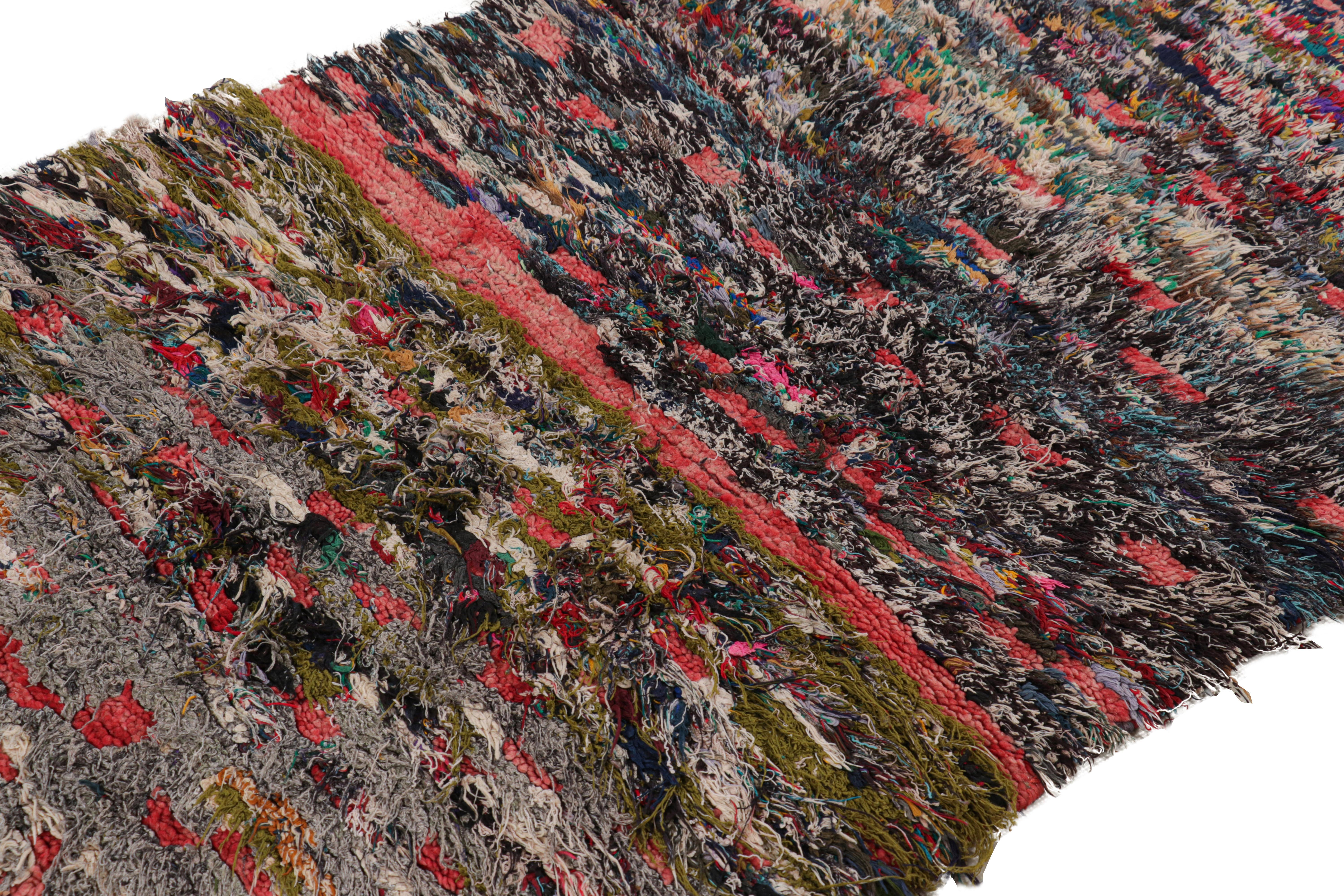 Hand-knotted in wool and originating from Morocco circa 1950-1960, this 3x6 special vintage rug features a colorful boho chic primitivist design. 

On the Design

Admirers of the craft will note that the colors have aged beautifully for a work of