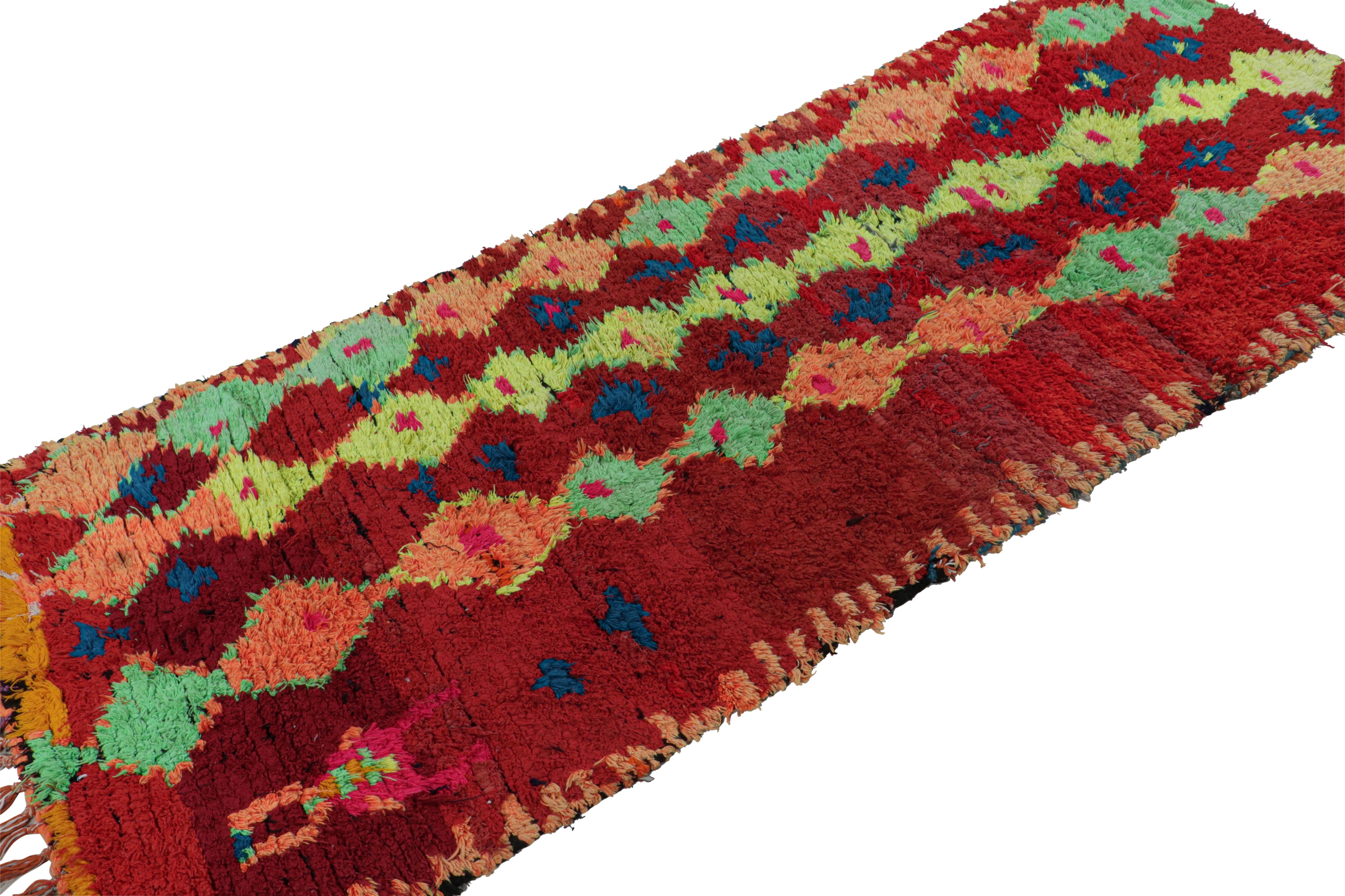 Hand-knotted in wool circa 1950-1960, this 4x9 vintage Moroccan rug with geometric patterns hails from the Azilal tribe.  

On the Design: 

This piece enjoys a rich burgundy red field, with polychromatic primitivist Berber diamond motifs, or