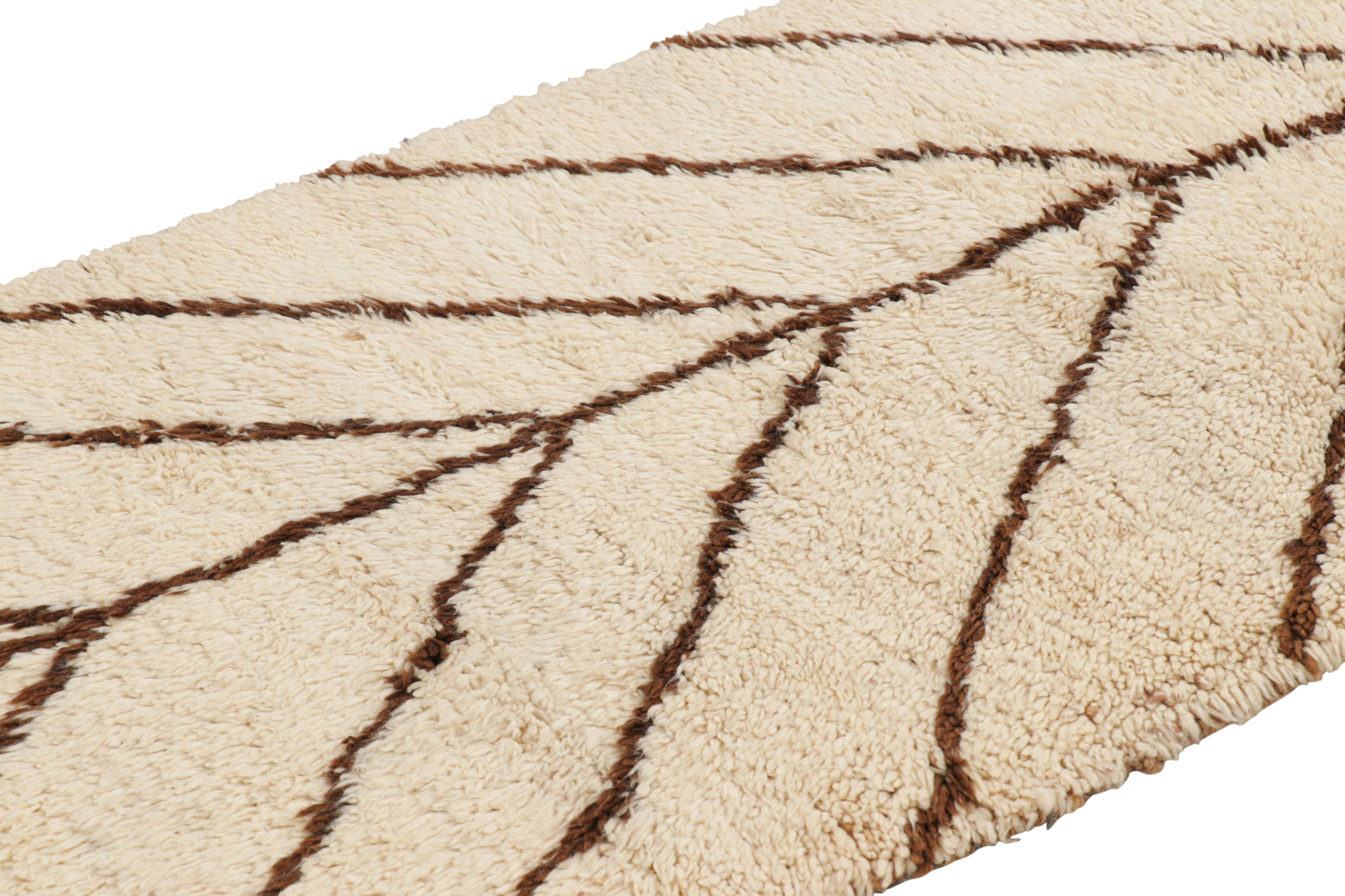 Hand-knotted in wool and originating from Morocco circa 1950-1960, this 3x6 vintage Moroccan rug is an extremely rare piece like so few of its provenance. 

On the Design: 

Admirers of the craft will note what an exceptional find this shabby chic