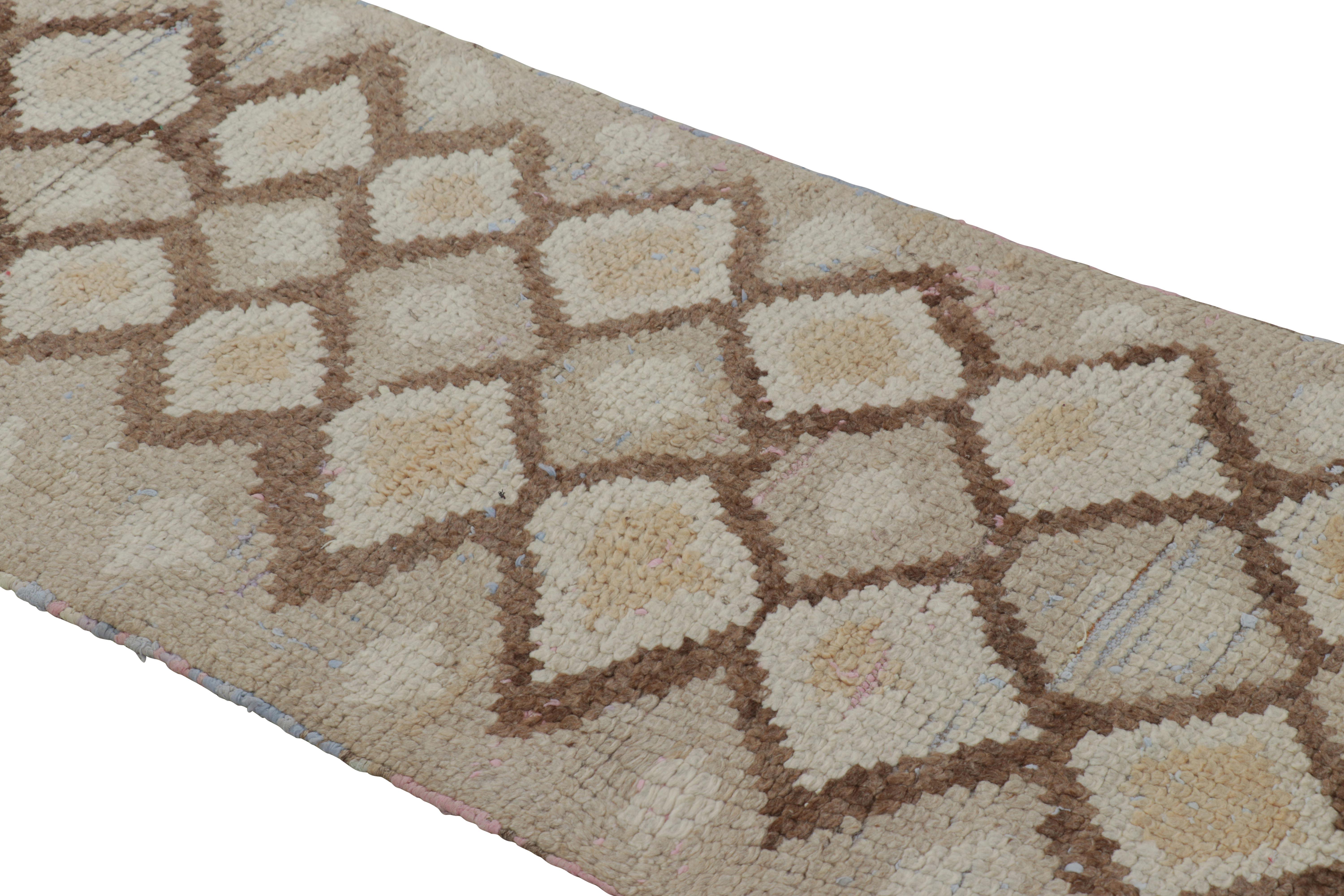 Hand-knotted in wool and originating from Morocco circa 1950-1960, this 2x5 vintage Moroccan rug is an extremely rare piece like so few of its provenance. 

On the Design: 

Admirers of the craft will note what an exceptional find this shabby chic