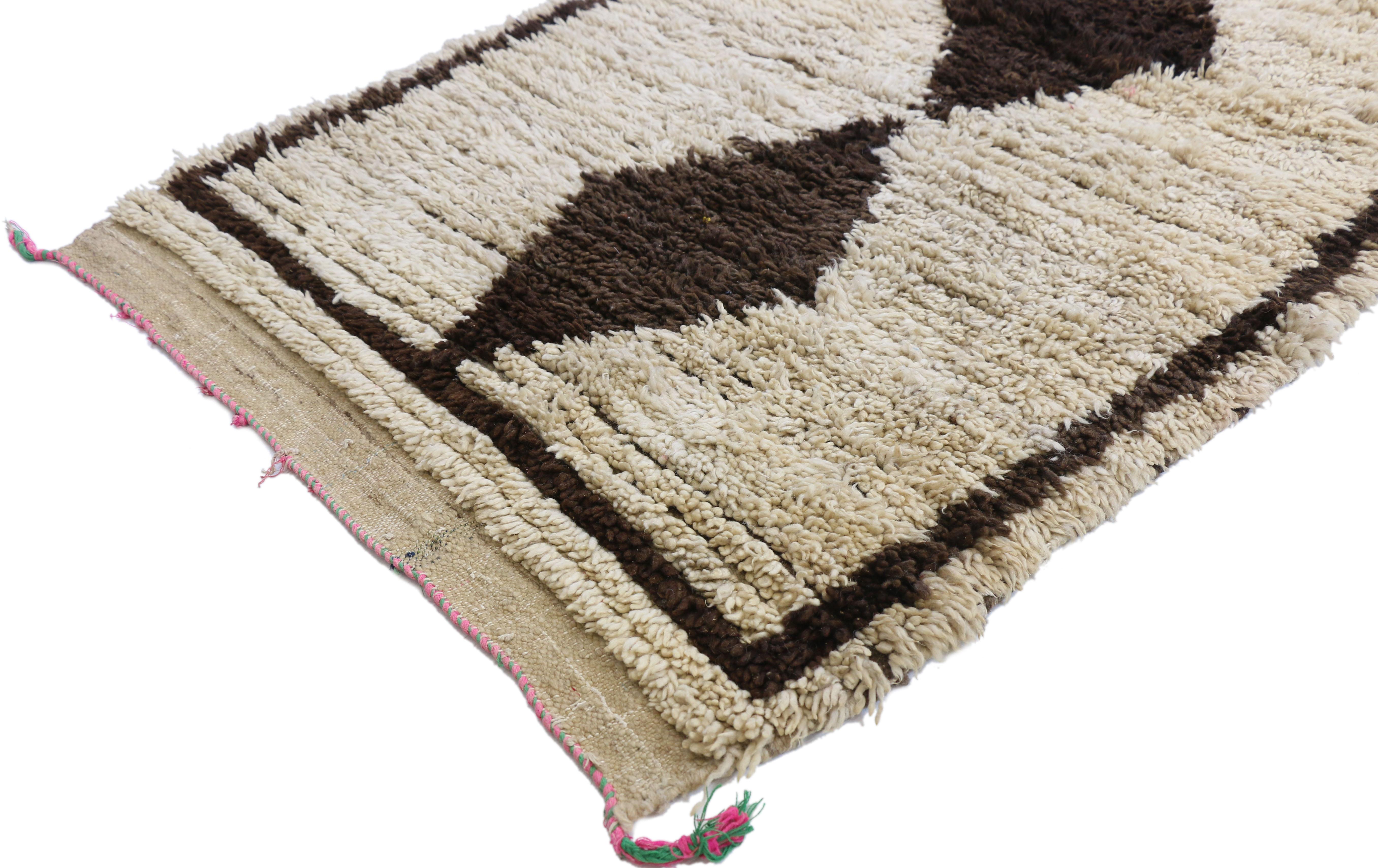 20790, vintage Moroccan runner with Bauhaus Primitive style, Shag hallway runner. This hand knotted wool vintage Moroccan runner features a column of irregular diamonds spread across the centre of an abrashed beige field, while a plain espresso