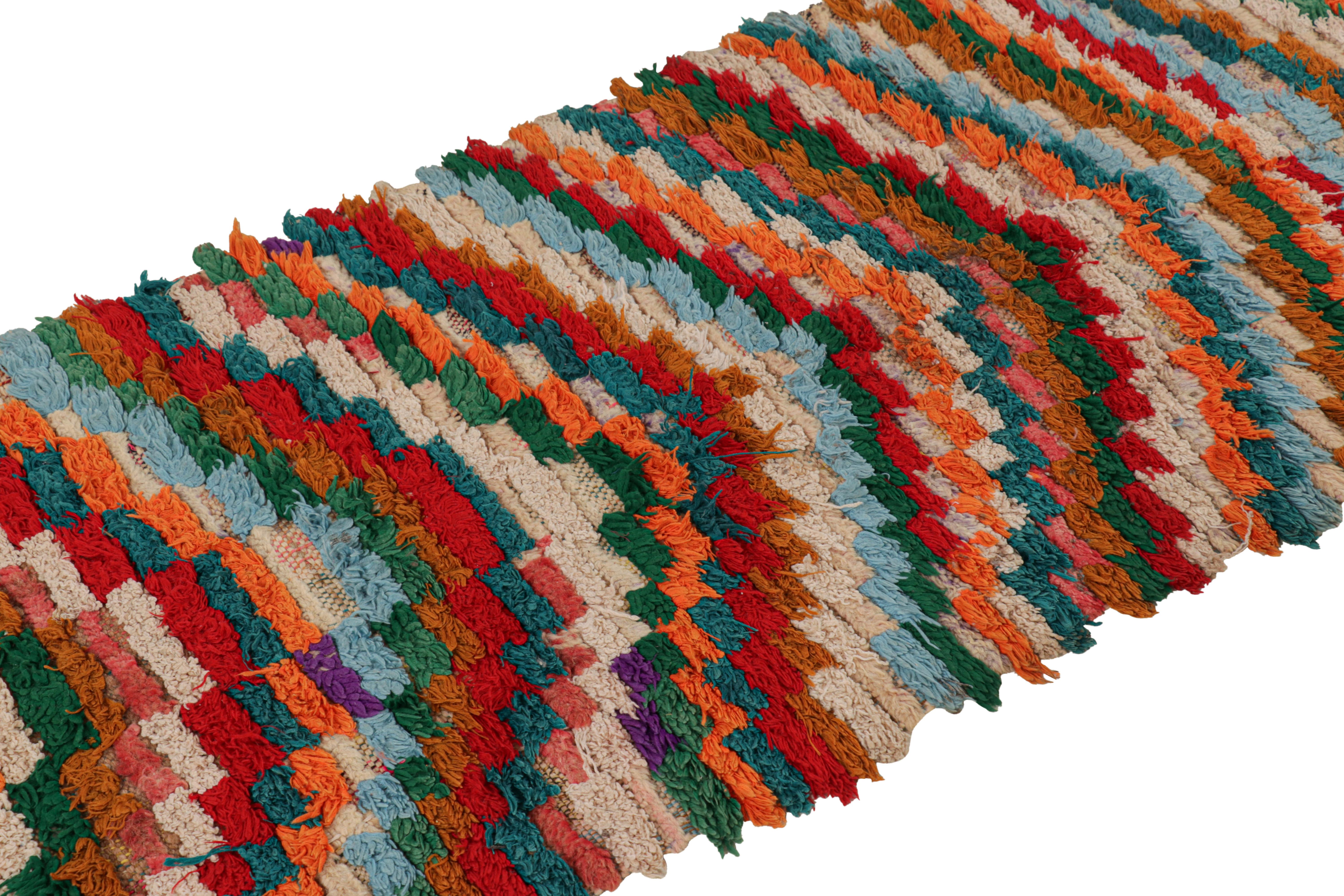 Hand-knotted in wool and originating from Morocco circa 1950-1960, this 2x10 vintage Moroccan rug is an extremely rare piece like so few of its provenance. 

On the Design: 

Admirers of the craft will note what an exceptional find this shabby chic