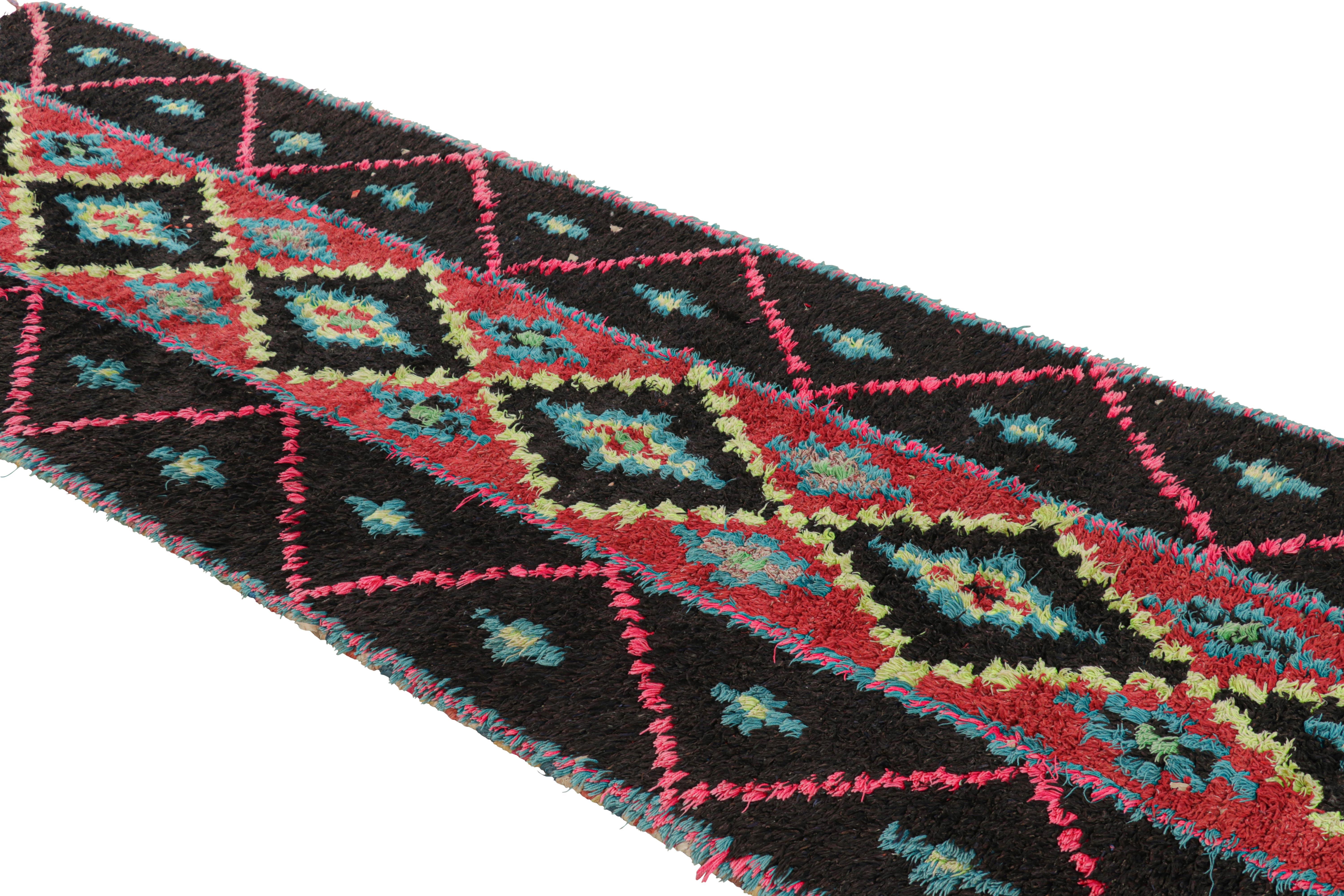Hand-knotted in wool and originating from Morocco circa 1950-1960, this 3x11 vintage Moroccan rug is an extremely rare piece like so few of its provenance. 

On the Design: 

Admirers of the craft will note what an exceptional find this shabby chic