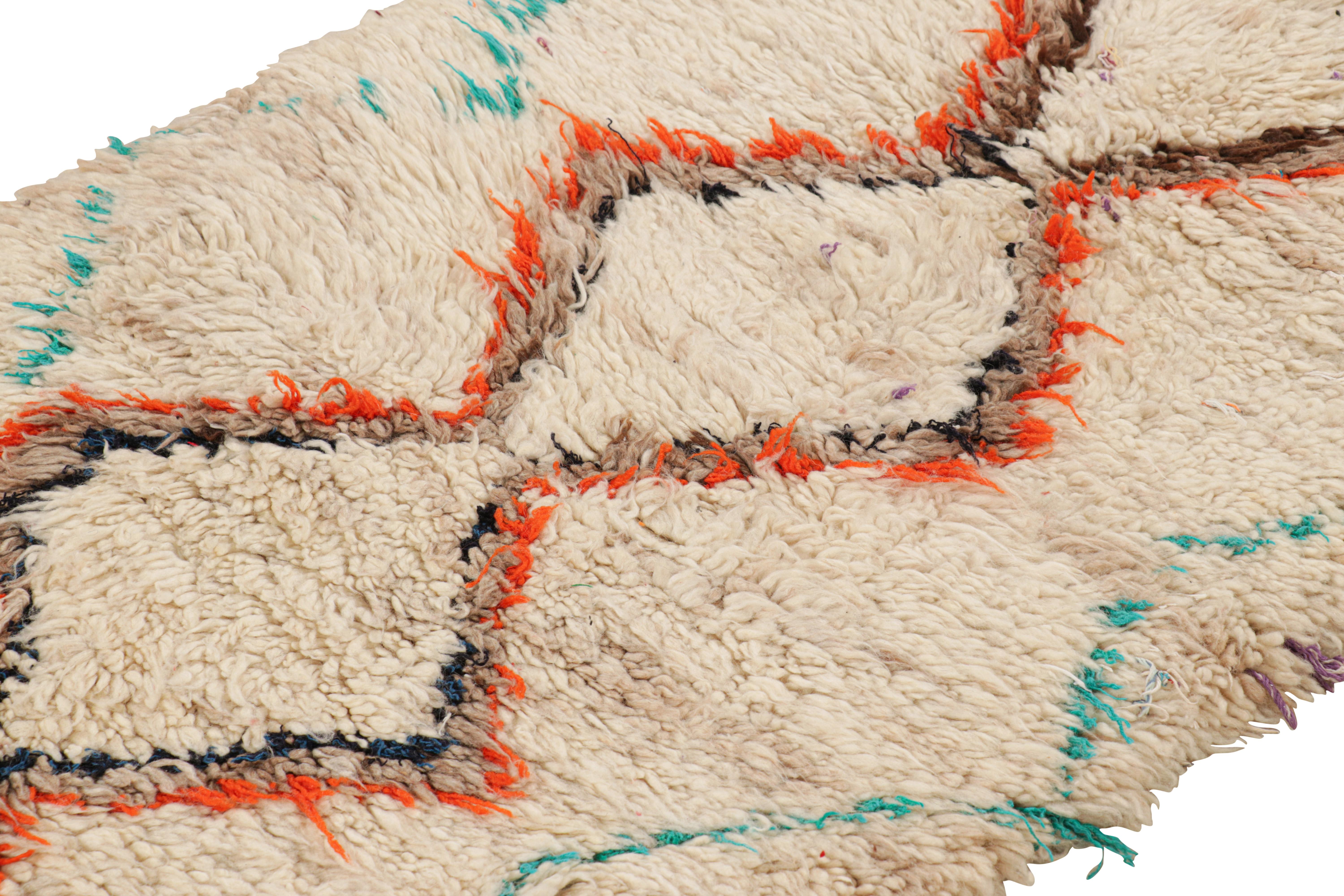 Hand-knotted in wool and originating from Morocco circa 1950-1960, this 3x6 vintage Moroccan rug is an extremely rare piece like so few of its provenance. 

On the Design: 

Admirers of the craft will note what an exceptional find this shabby chic
