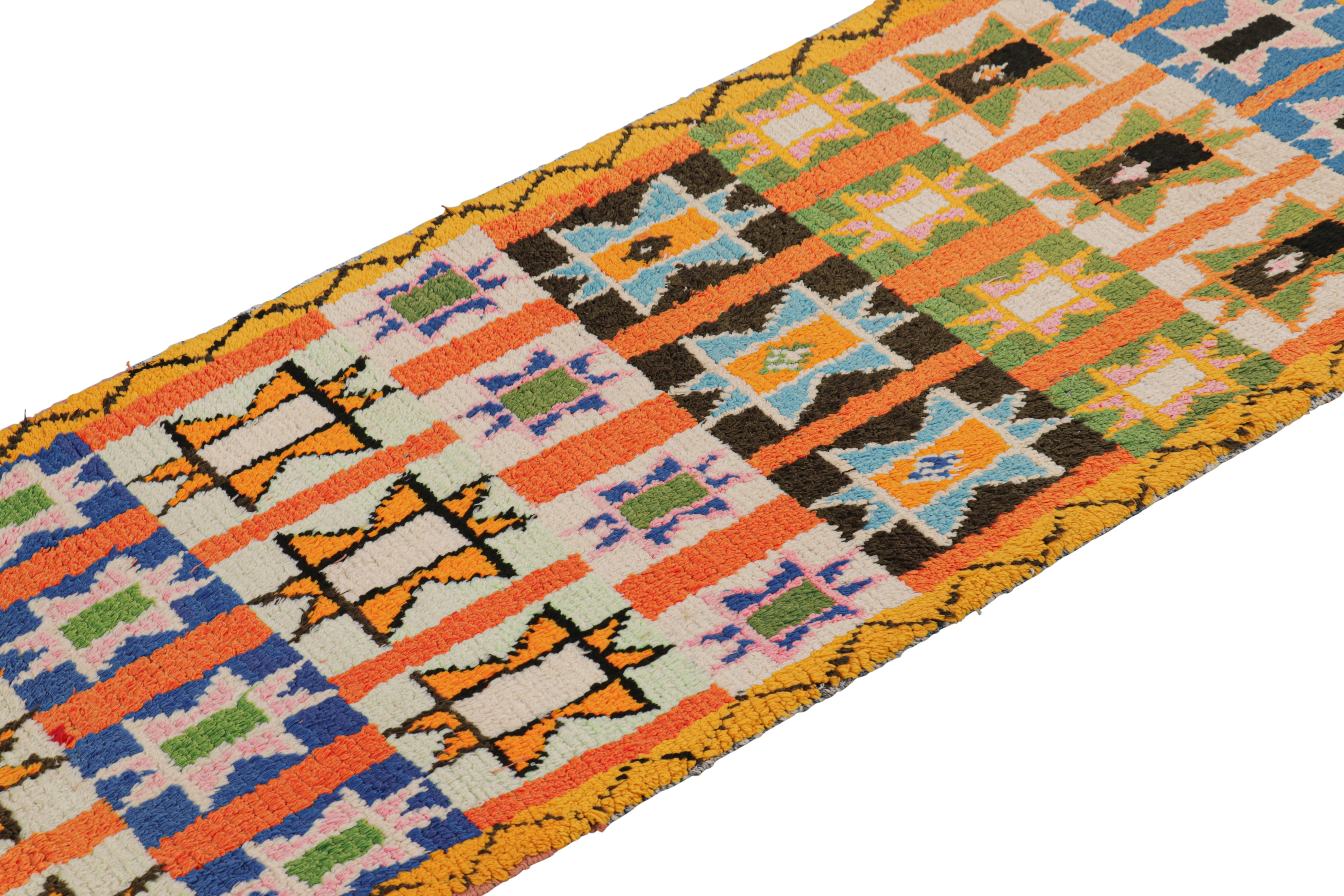 Hand-knotted in wool and originating from Morocco circa 1950-1960, this 2x8 vintage Moroccan rug is an extremely rare piece like so few of its provenance. 

On the Design: 

Admirers of the craft will note what an exceptional find this shabby chic