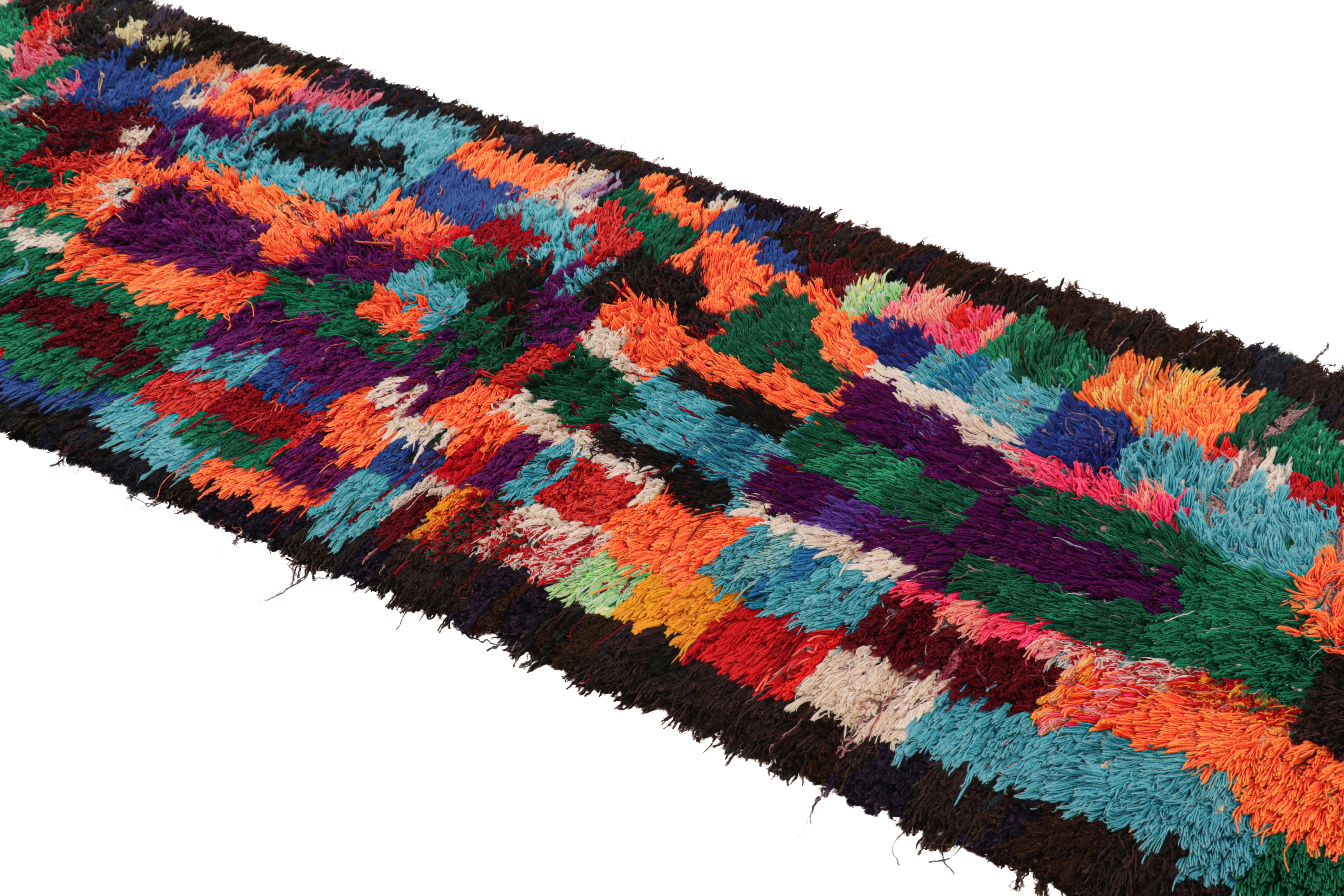 Hand-knotted in wool and originating from Morocco circa 1950-1960, this 3x9 vintage Moroccan rug is an extremely rare piece like so few of its provenance. 

On the Design: 

Admirers of the craft will note what an exceptional find this shabby chic