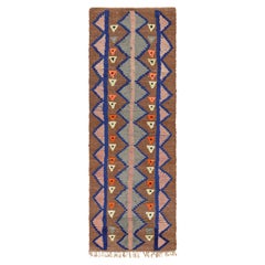 Alfombra marroquí vintage con motivos geométricos policromados, de Rug & Kilim