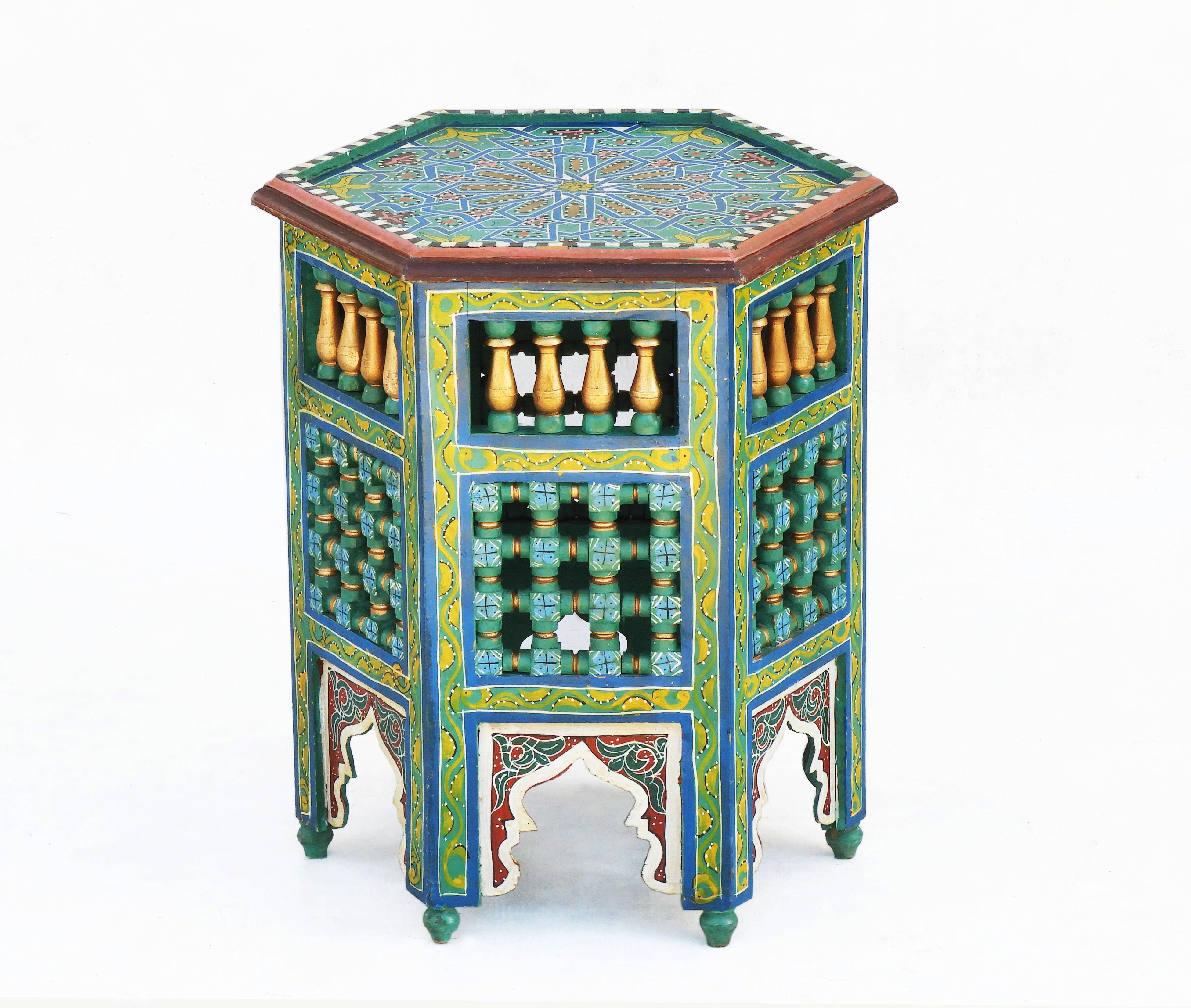 VintageMoroccan handcrafted and hand-painted side table or tabouret stool.
Attractive hexagonal form with Moorish arches.
Colourful Moroccan side table in a Hispano Moresque style with Moorish floral and geometrical designs.
A nice Bohemian accent