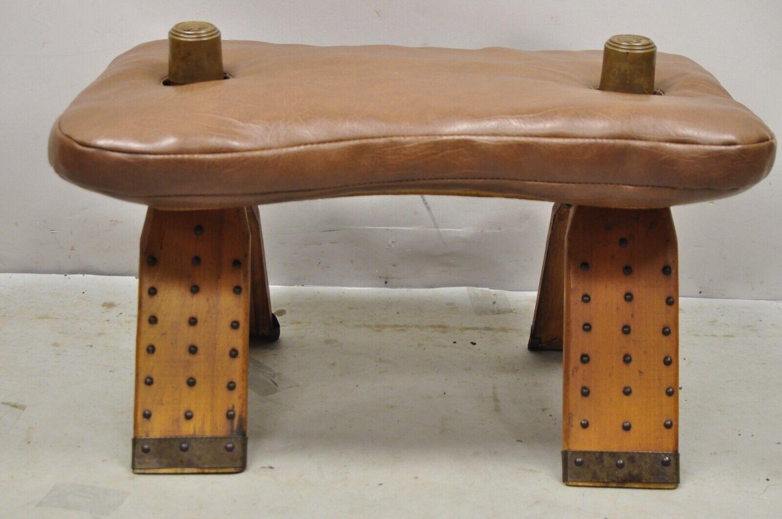 20th Century Vintage Moroccan Style Brown Vinyl Wooden Camel Saddle Ottoman Stool For Sale