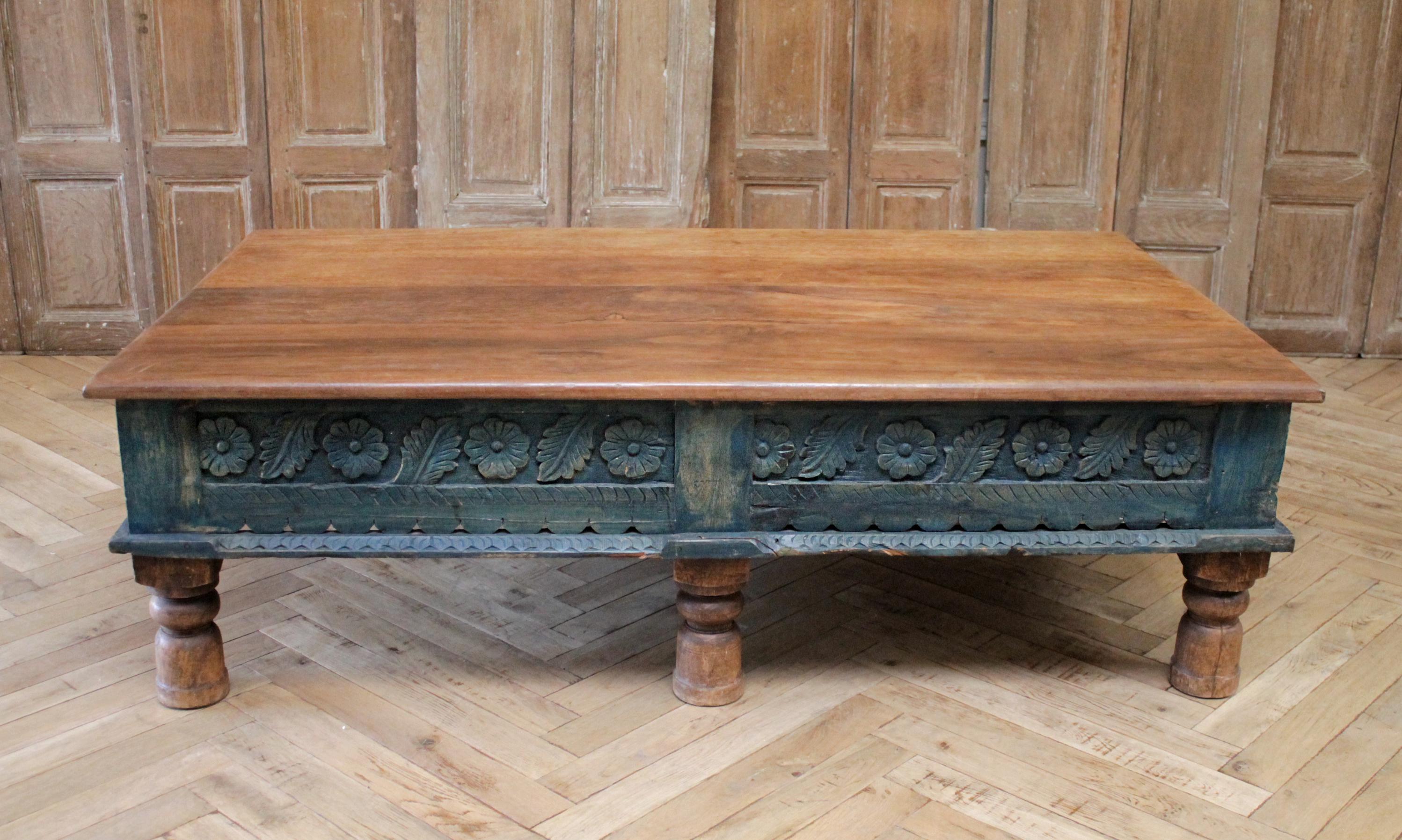 Vintage Moroccan style carved wood coffee table
Base is painted in a greenish blue color with natural wood tone top.
Very solid and sturdy.
Measures: 60