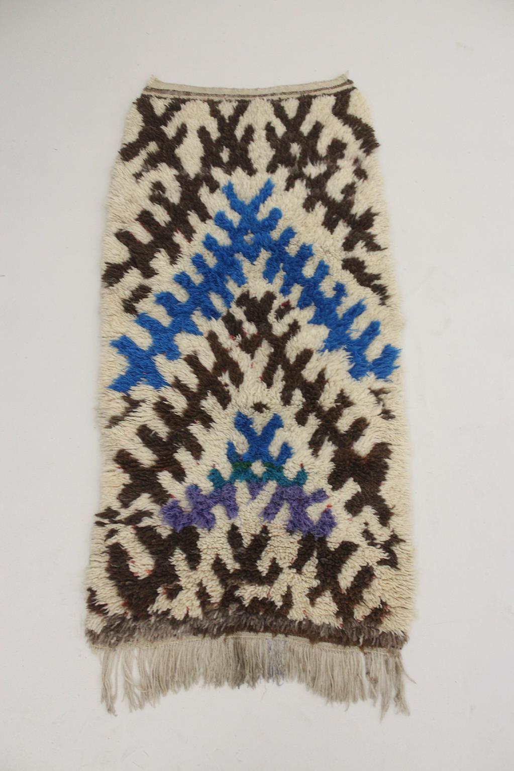 Here is a lovely tribal, plush rug that is not as neutral as you would think, despite a beige background and mostly brown designs. It also shows the most beautiful blue color, and a touch of purple and green! The intricate pattern is typical from