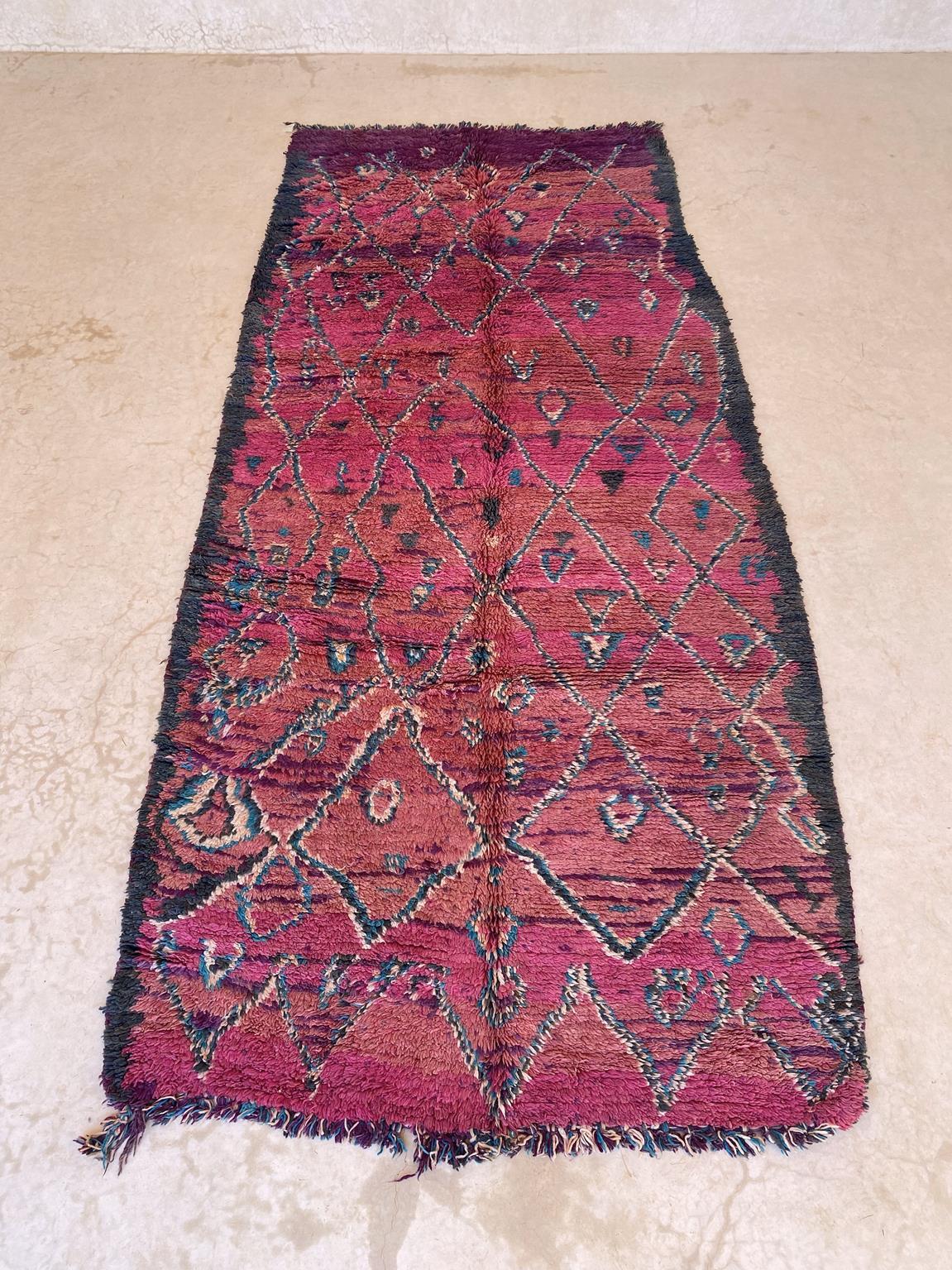 Here is one very beautiful, unique vintage rug, probably from the Talsint tribe. The colors are so fresh, from a fuchsia to a warm purple with gray, white and emerald green designs, unregular lines with tiny diamonds and triangles. It shows very