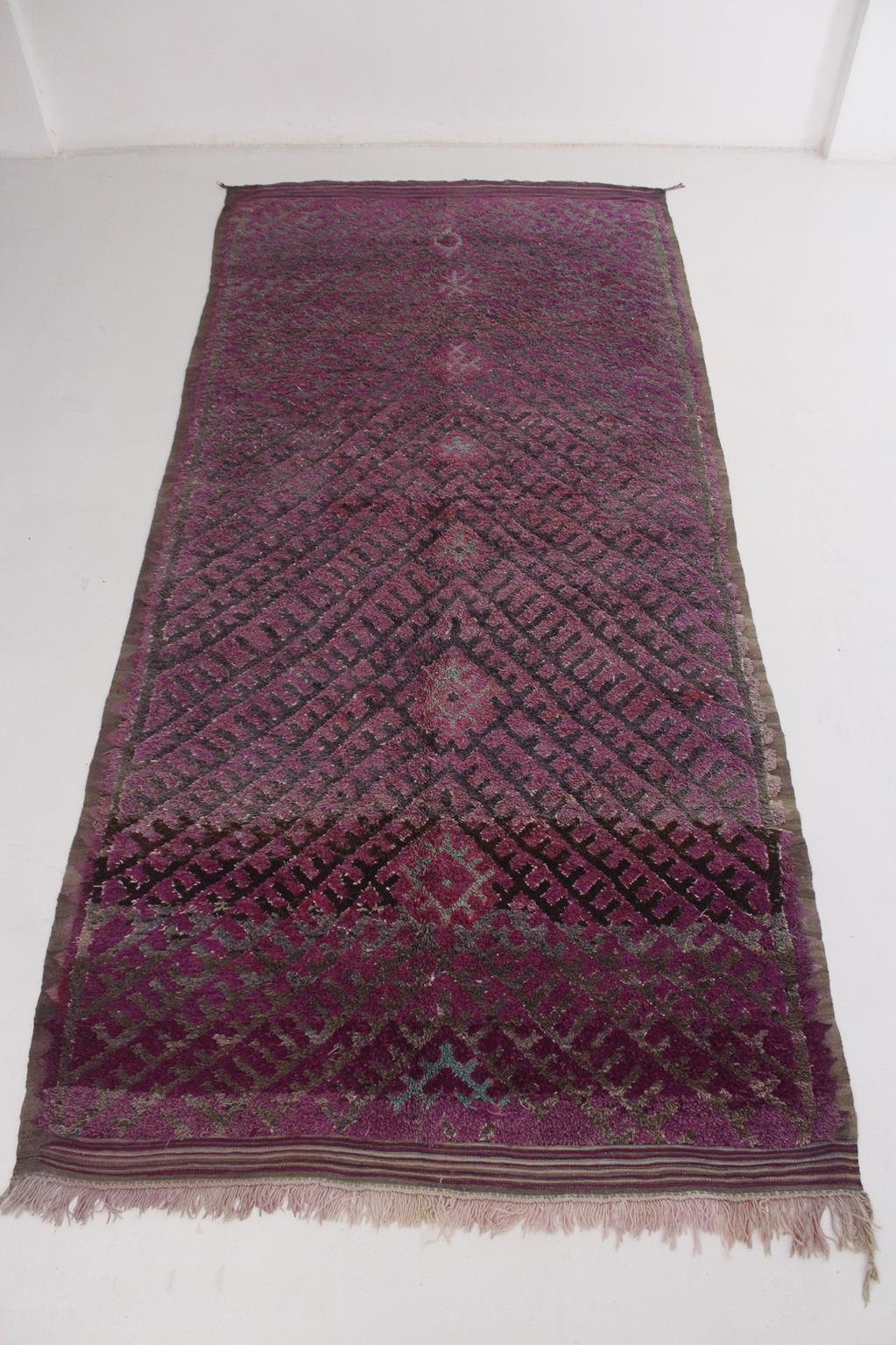 I picked that one from piles of carpets because I think that it's a beautiful, unique, tribal and such elegant piece with a great composition! Would look great under a long dining table!

Colors are several tones of purple and gray with a serie of