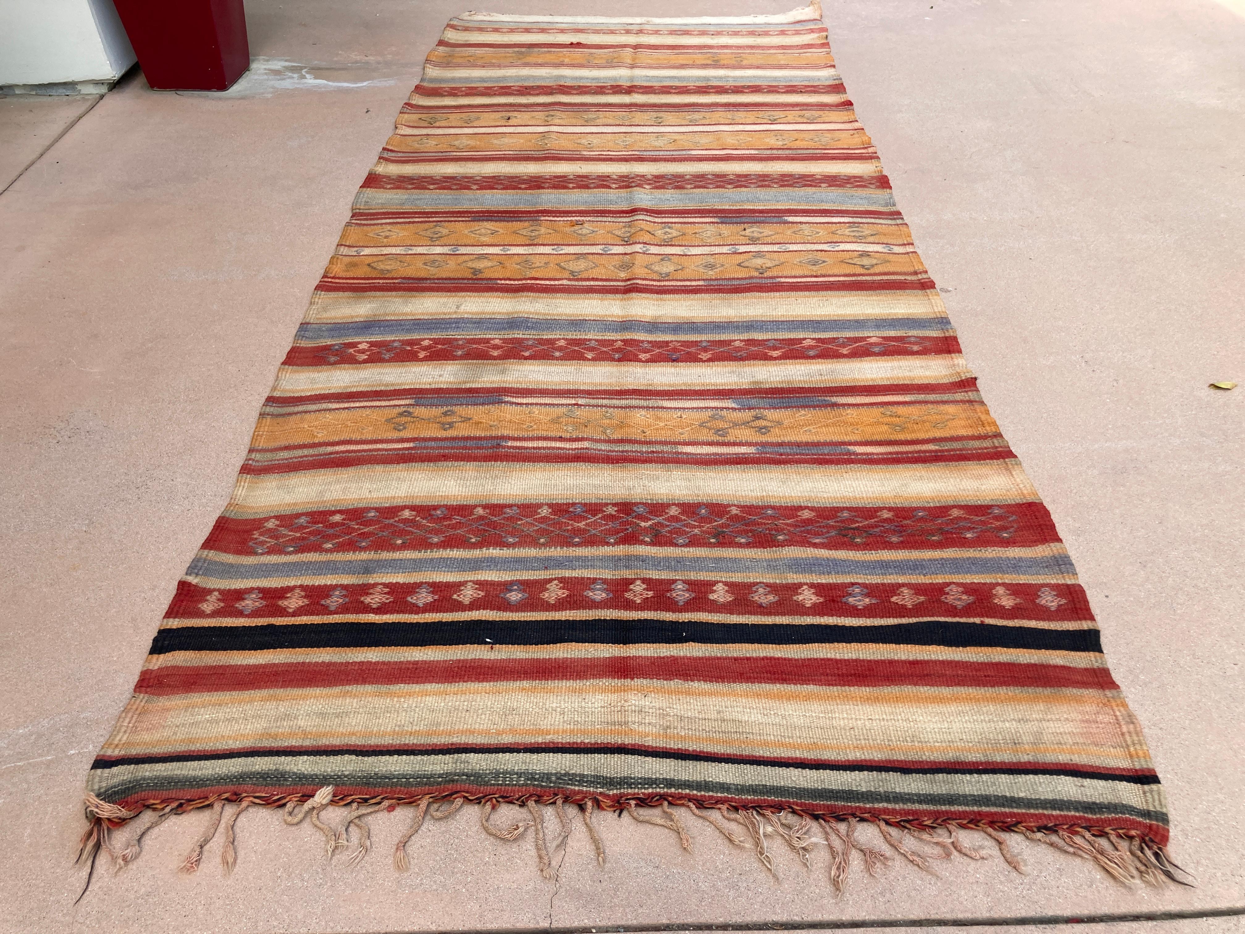 1960s Moroccan Rug Ethnic Flat Hand-woven Kilim 
Large handwoven vintage Moroccan Berber Tribal Kilim rug, nicely aged with muted colors.
Handwoven by the Berber tribes in south Morocco with traditional geometric tribal designs.
South of Marrakech