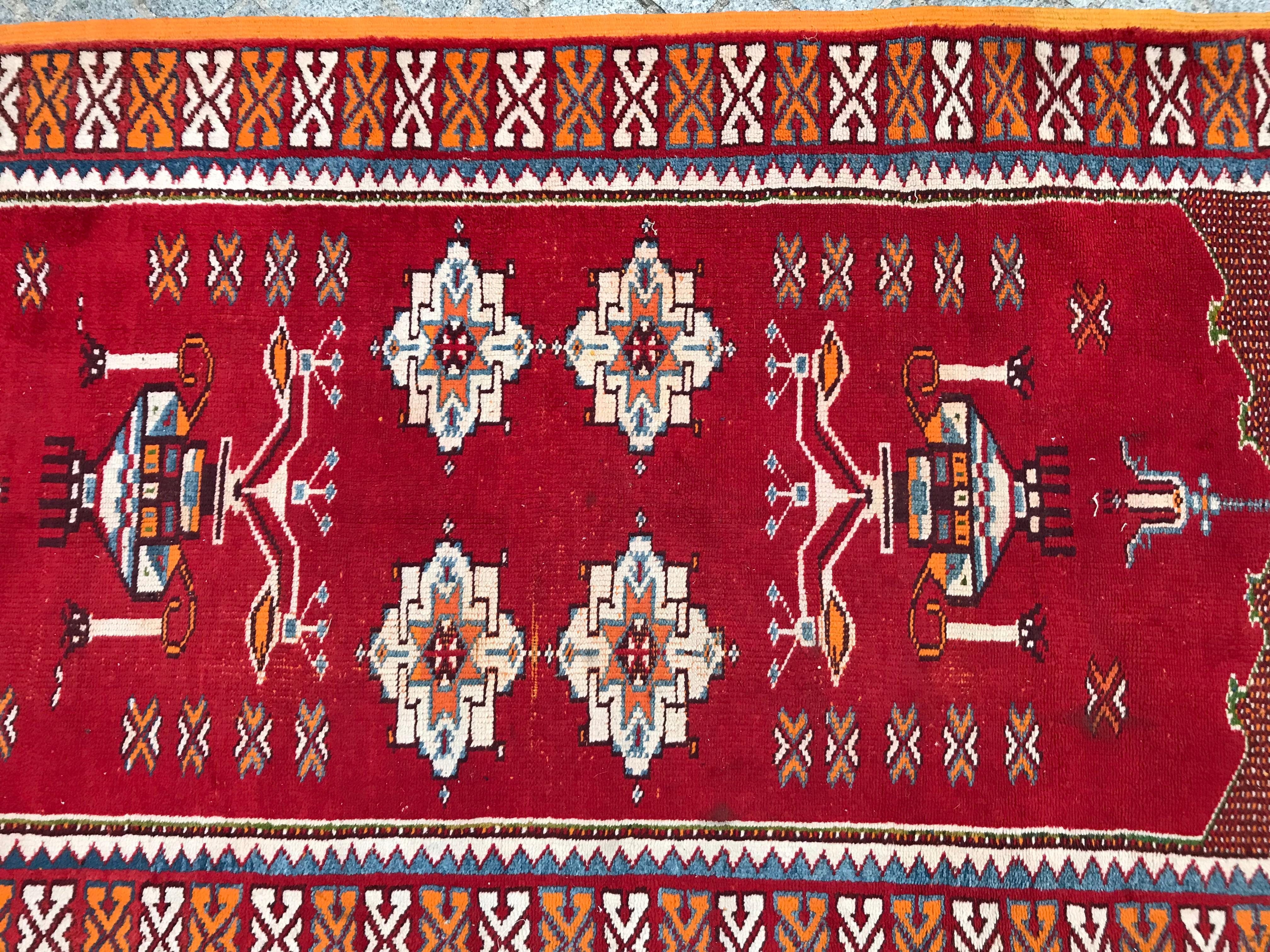 Beautiful 20th century Moroccan Berbere rug, with nice red field and tribal design, entirely hand knotted with wool velvet on wool foundation.
  