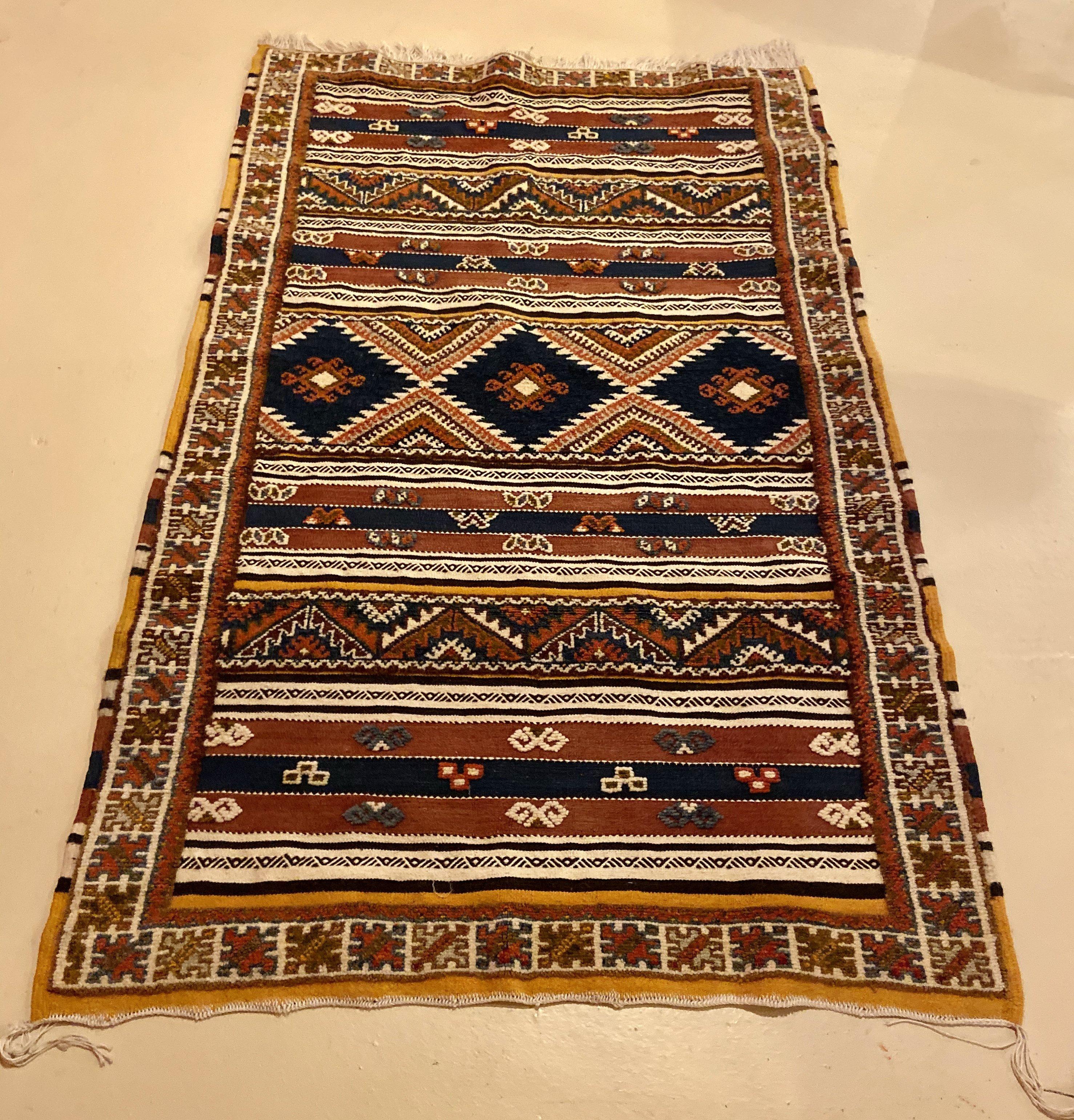 This Moroccan vintage tribal rug or carpet is a stunning and sophisticated addition to your living room, dining room, entryway or bedroom, this rug and its exquisite, captivating pattern will never go out of style. The rug is handwoven carpet from