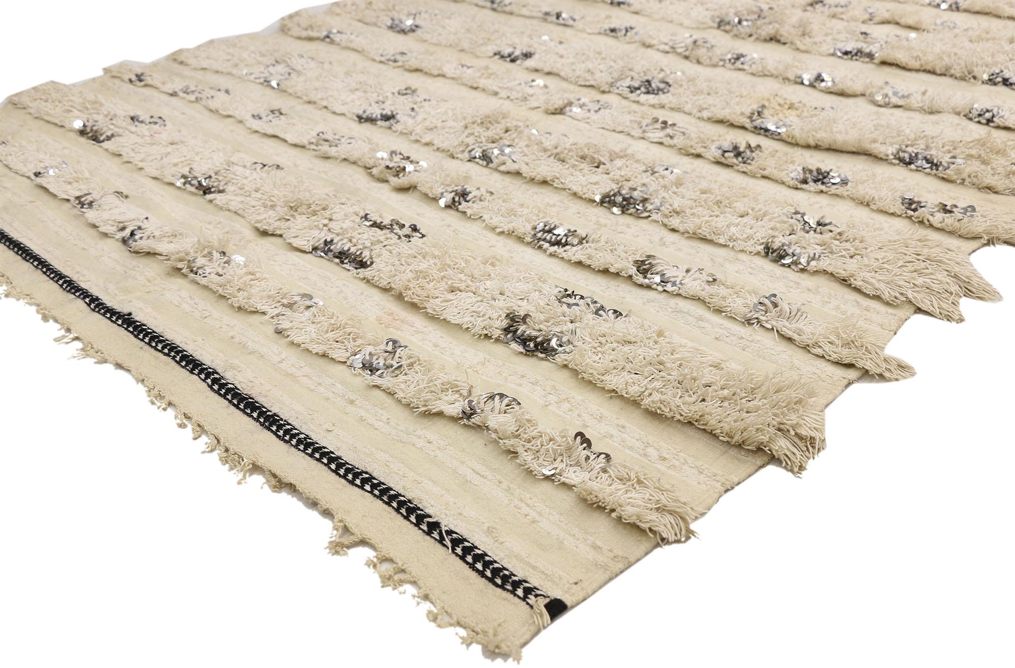 20821, vintage Moroccan wedding blanket, Berber Handira Tamizart. This handwoven wool vintage Moroccan wedding blanket also known as a Berber Handira features rows of fluffy fringe embellished with paillette sequins. The underside of this vintage