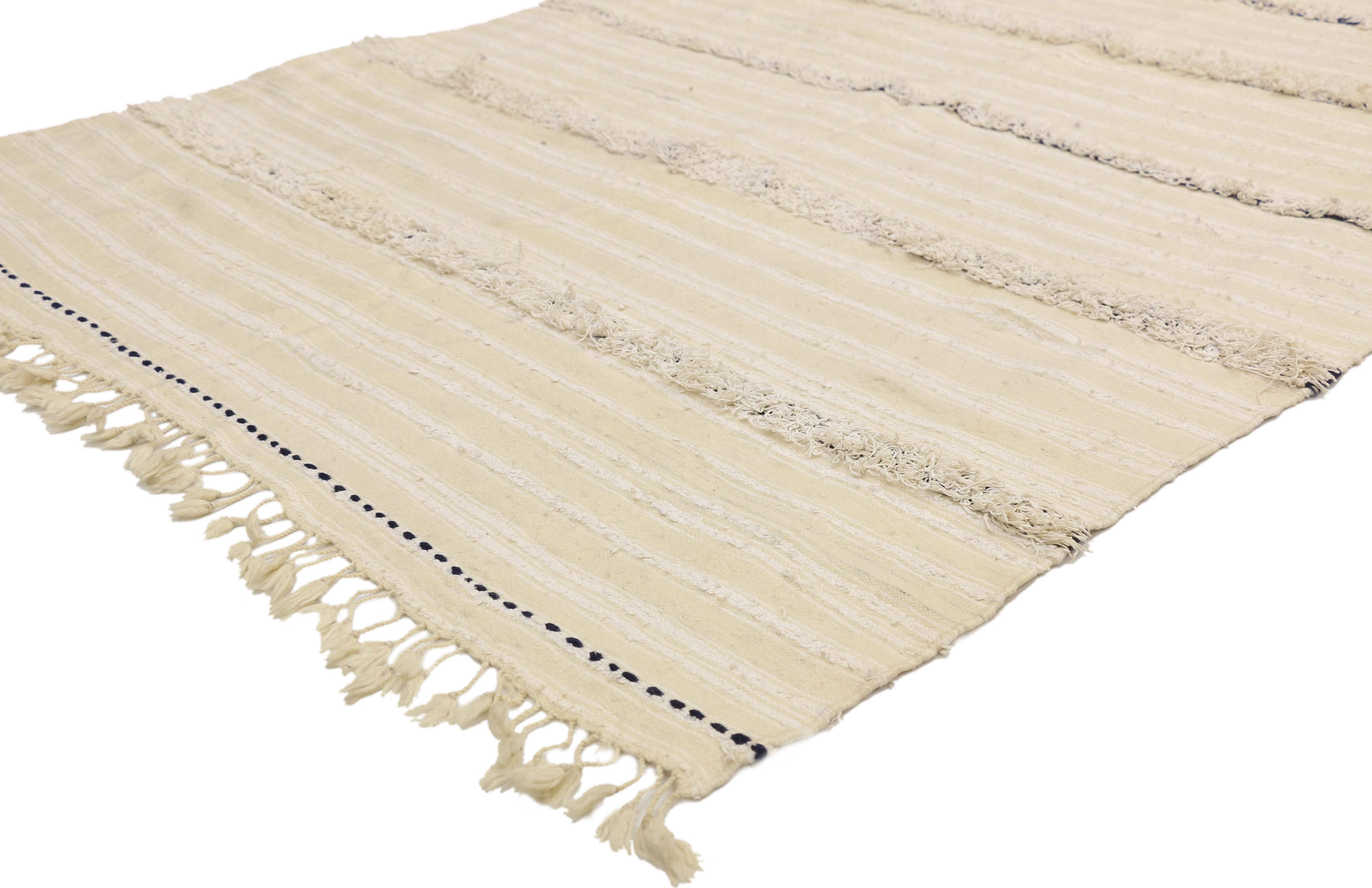 20826 Vintage Moroccan wedding blanket, Berber Handira Tamizart 04'00 x 06'10. This handwoven wool vintage Moroccan wedding blanket also known as a Berber Handira features rows of fluffy fringe embellished with accent colors. The underside of this