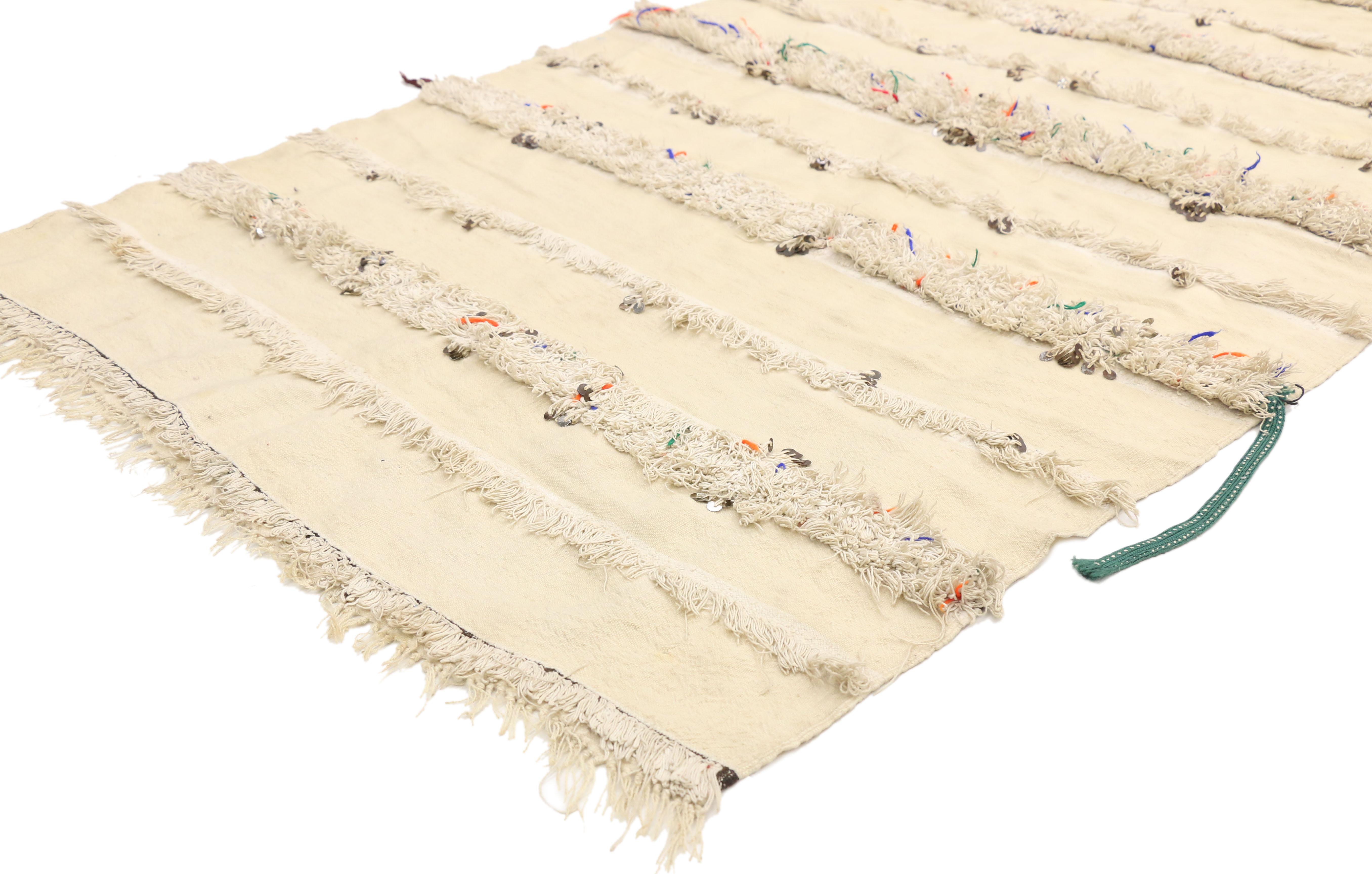 20831, vintage Moroccan wedding blanket, Berber Tamizart Handira with original cape ties. This handwoven wool vintage Moroccan wedding blanket also known as a Berber Tamizart Handira features rows of fluffy fringe embellished with paillette sequins.