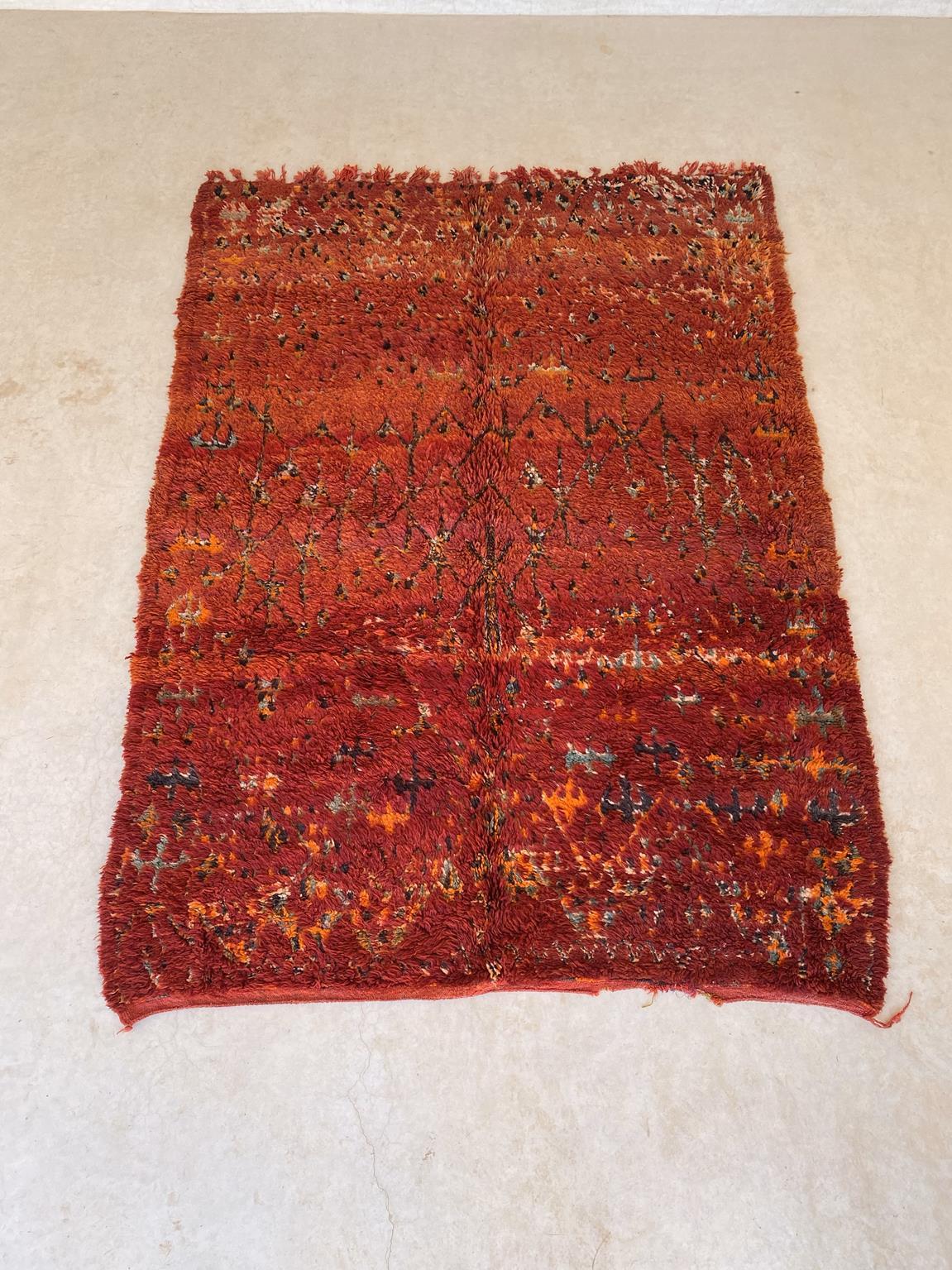 This vintage Zayane rug is just gorgeous! The perfect bohemian rug to bring warmth and character to your space!

The background color of this rug is a deep red but I guess you can tell from the pictures attached that it shows different shades