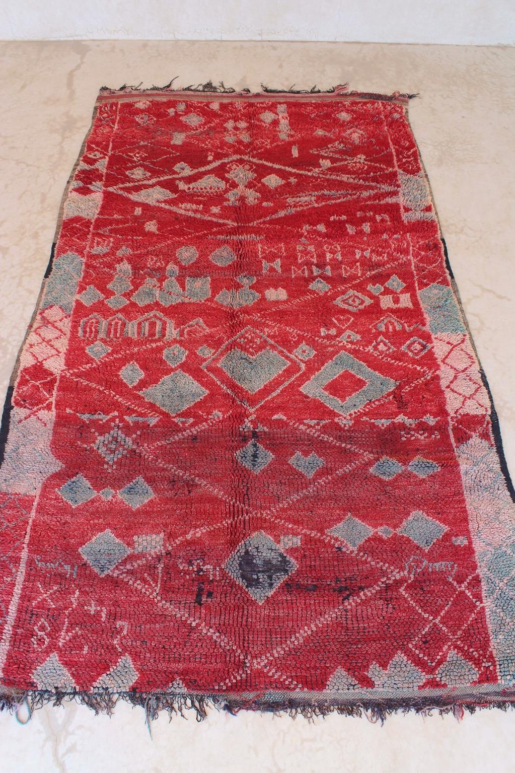 This real vintage Zayane rug truly is a collector find! The perfect artistic rug to bring warmth and extra character to your space!

The background color of this rug is a deep red but I guess you can tell from the pictures attached that it shows