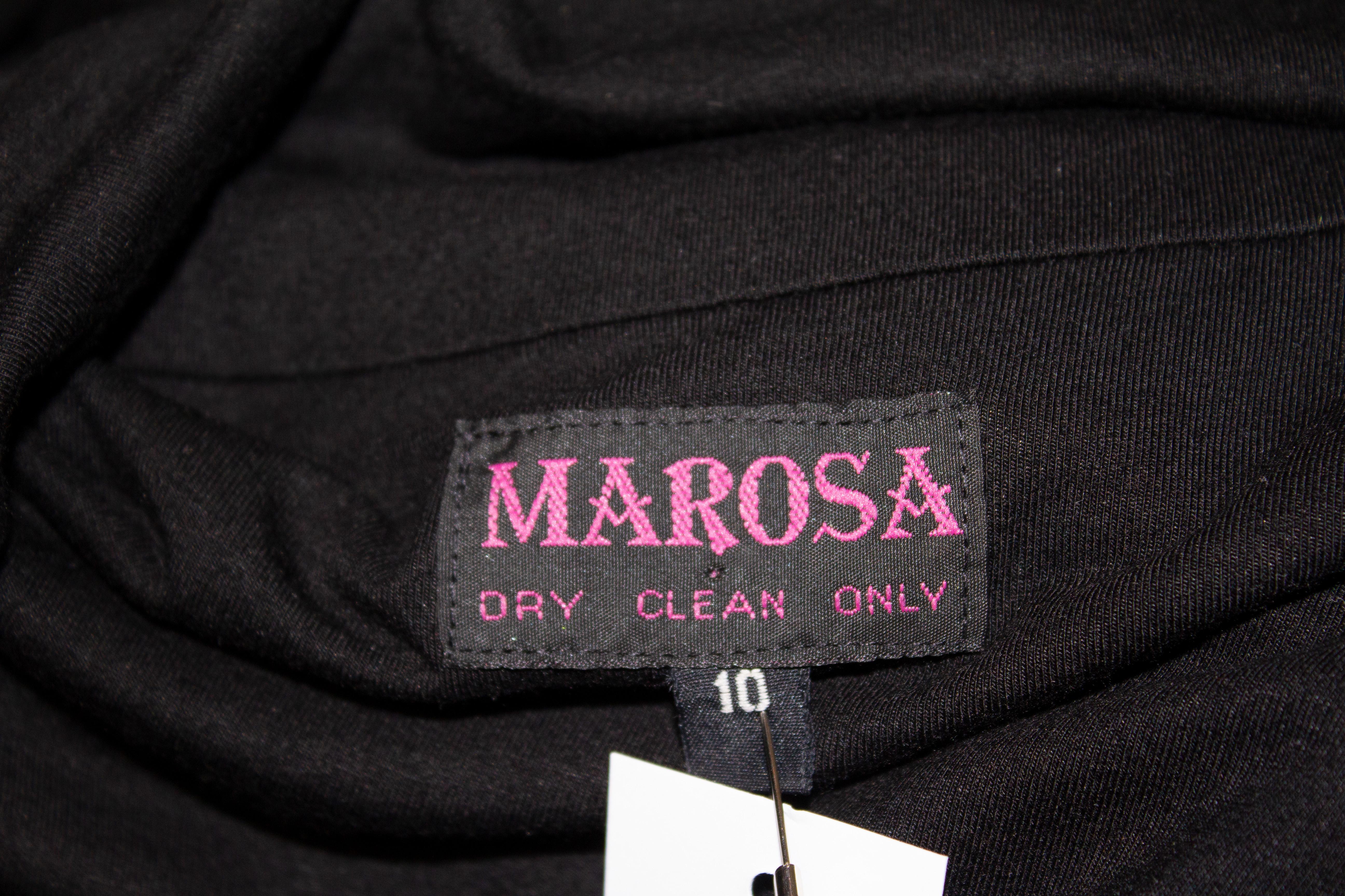 A fun and easy to wear vintage dress by Morosa. In a black jersey fabric with embellishment on the cuffs and hem. Measurement Bust 37'' ,length 47''